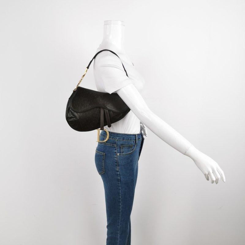 Dior Saddle Vintage Ostrich Leather Dark Brown Shoulder Bag
These are professional photos of the actual bag.
  CONDITION: EXCELLENT
  DETAILS: 
  
  Brand: Christian Dior
  
  Model: Saddle Vintage
  
  Color: Brown
  
  Material: Ostrich Leather
 