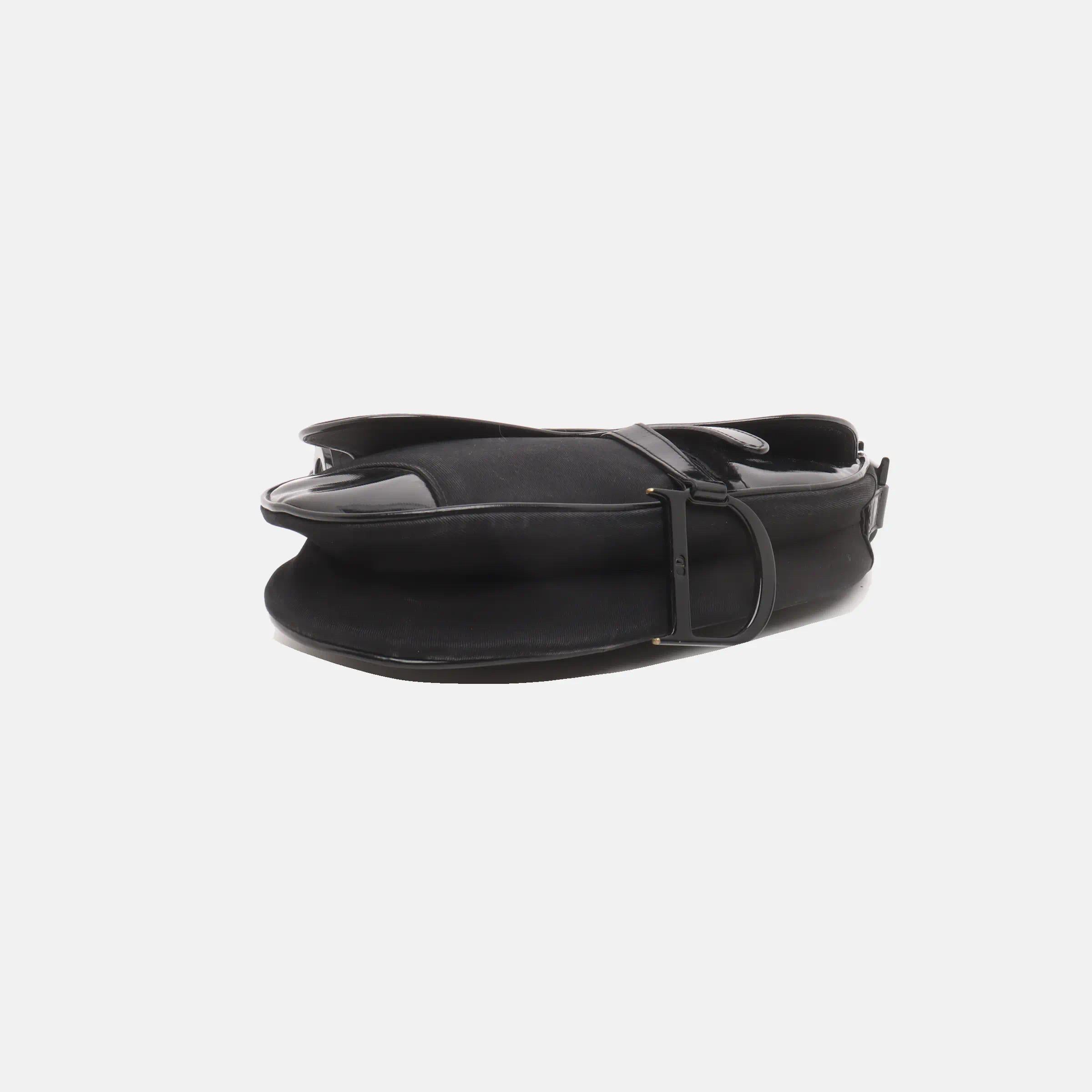 The Dior Saddle Vintage Black is an iconic kidney-shaped saddle bag, originally designed by John Galliano. This vintage version offers more room and a softer feel compared to the modern reissue. Perfect for adding a touch of classic elegance to any