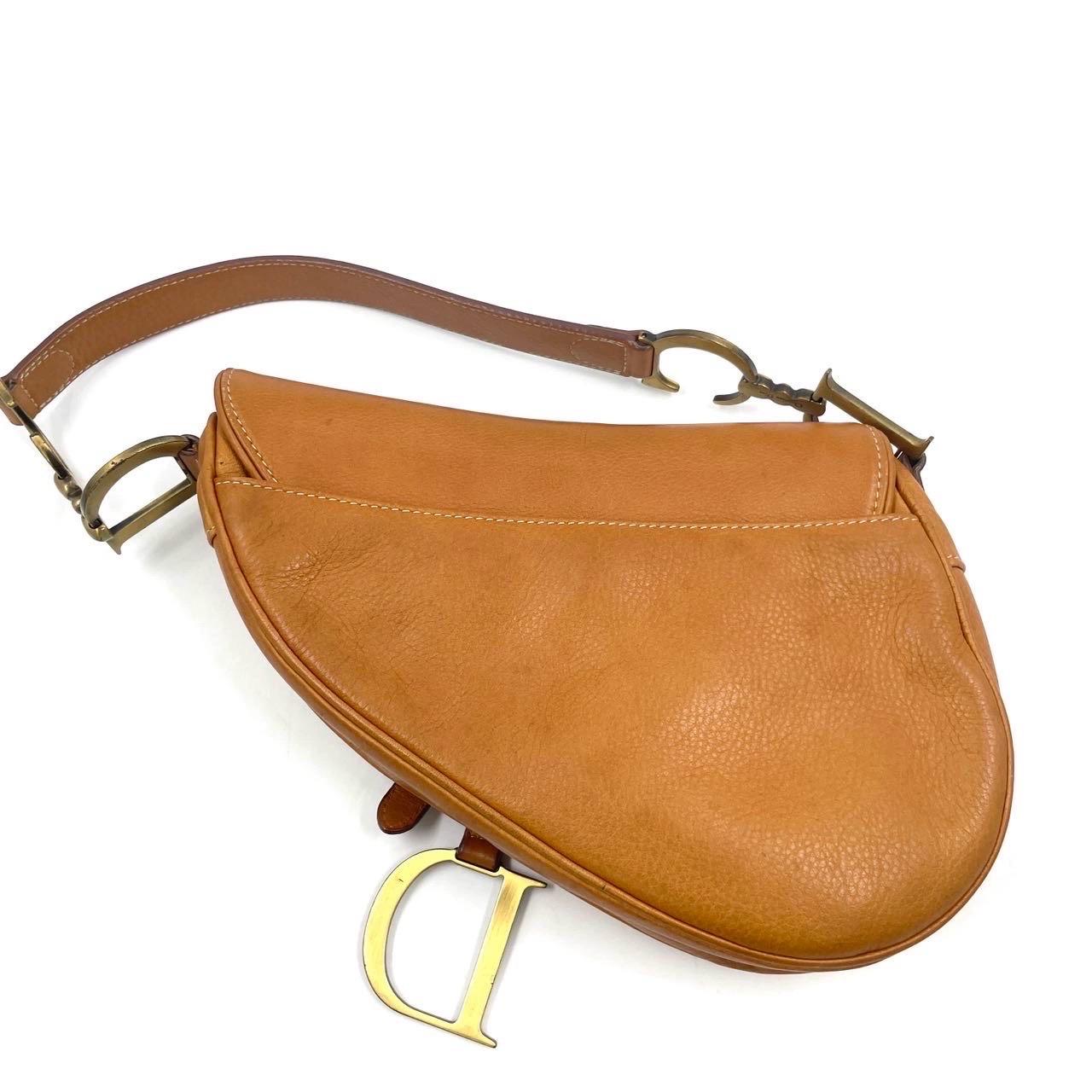 CONDITION: VERY GOOD

This vintage authentic Dior saddle bag is in good condition with light scuffs around the base, and light scratches on the leather. Scratches to the hardware. Light stains on the leather.

DETAILS: 

Brand: Christian