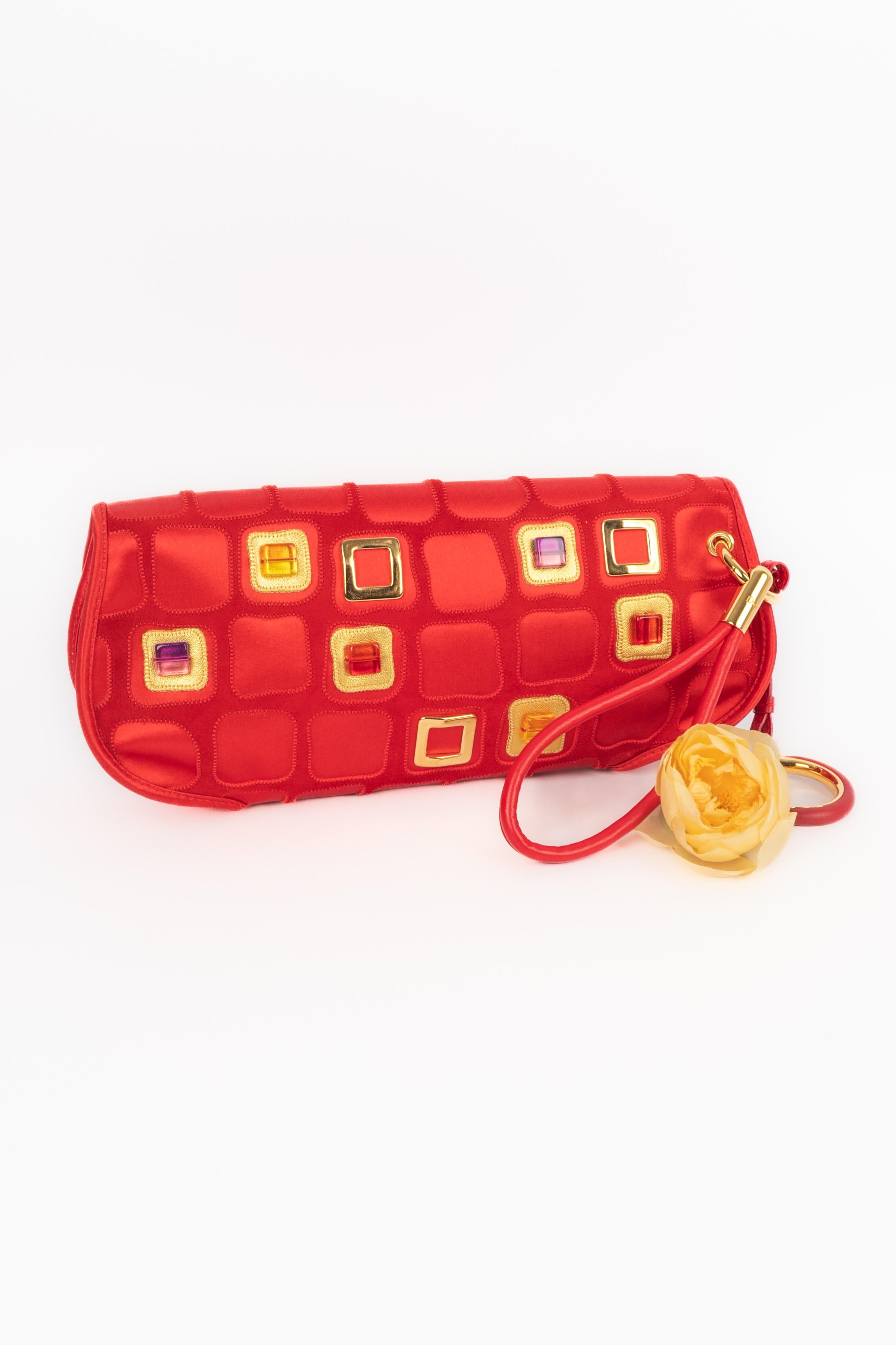 DIOR - (Made in Italy) Black satin handbag sewn with leather patches and colorful resin pearls. Limited edition, number 61.

Condition:
Very good condition

Dimensions:
Width: 21 cm - Height: 15 cm - Depth: 6 cm

SKU:S293