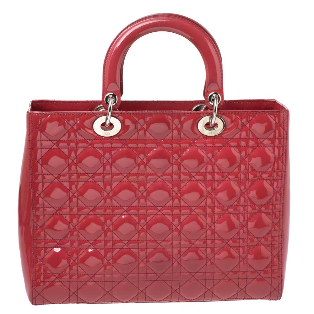 The Lady Dior tote is a Dior creation that has gained recognition worldwide and is today a coveted bag that every fashionista craves to possess. This Red tote has been crafted from patent leather and it carries the signature Cannage quilt. It is