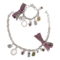Conjunto Dior de collar y pulsera de metal plateado
