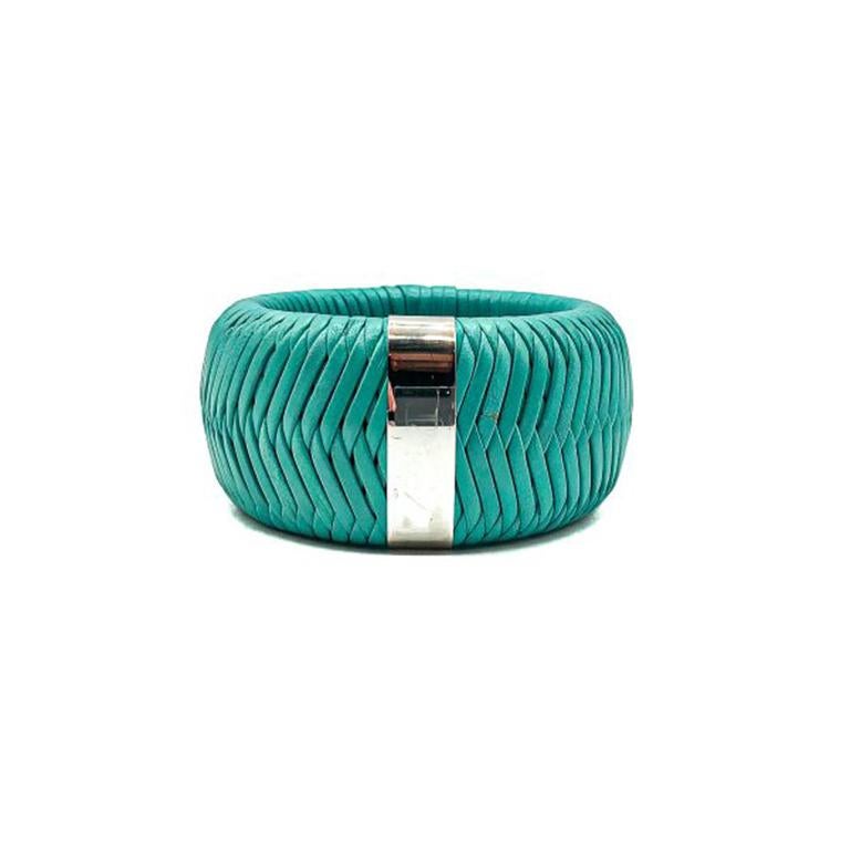 A gigantic, jumbo Dior Green Leather Weave Bangle. Crafted in a gorgeous aqua shade of woven leather with a chromed band (originally finished with the name of Dior which has faded). In very good condition aside from a couple of very minute nicks in