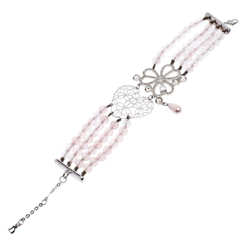 Known for its fashion jewelry, Dior never fails to impress when it comes to designing ultra-feminine creations. This bracelet is designed with multiple rows of light pink beads with a cutout metal heart and embellished floral charms at the centre.