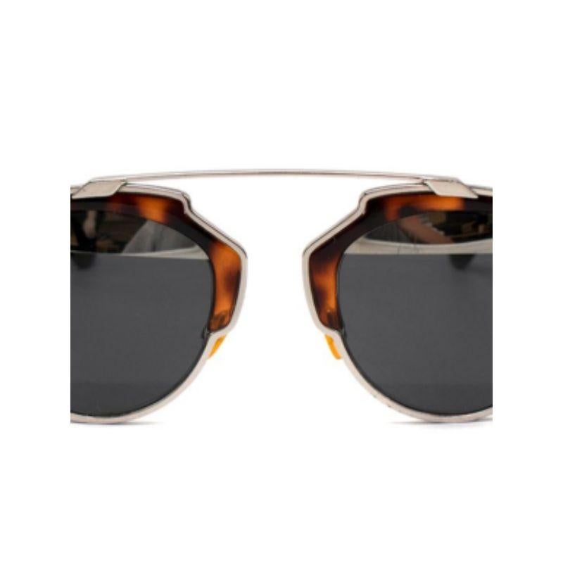 Dior So Real Tortoiseshell Sunglasses

- Silver tone metal body 
- Brown tortoise shell front panel and arms 
- Mirrored/ tinted lenses 

Materials:
Metal
Acetate

9/10 very good condition, with minor signs of wear, slight scratching to the arms.