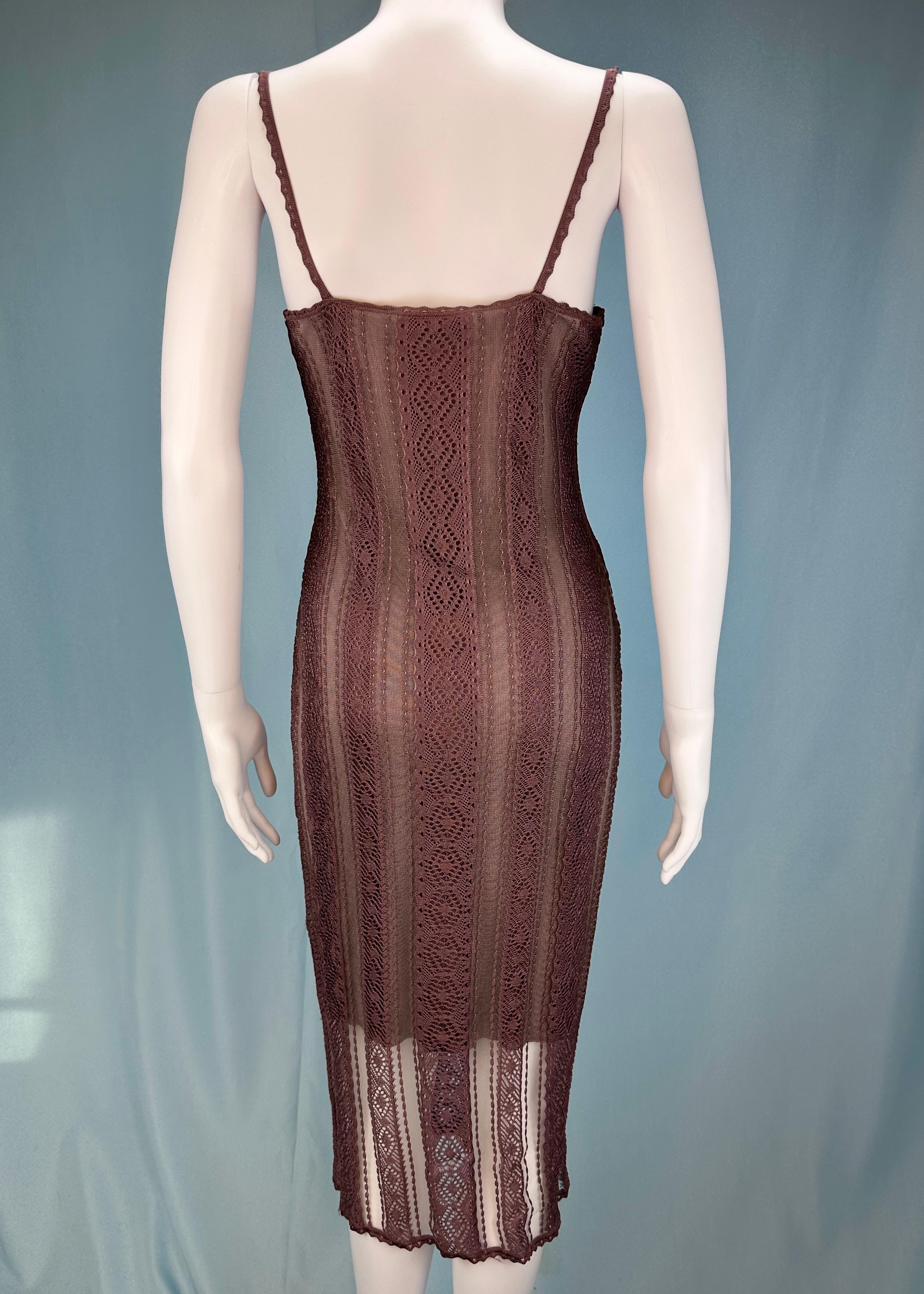 Vintage Dior
by John Galliano 
Spring 2000 

Mauve purple knit mesh midi dress
Purple underdress attached 

Size UK 10 / US 6
Can fit a variety of sizes due to stretch
Measurements (laid flat) -

32-36” chest 
36-32” waist 
35-40” hips
44” length 