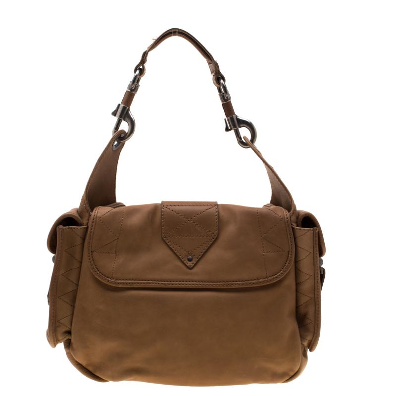 Incorporate a touch of sophistication to your everyday looks with this inviting Rebelle hobo. It is crafted from leather and features a slouchy silhouette enhanced by flap pockets to the sides, buckles trims and perceptible stitchig details. It