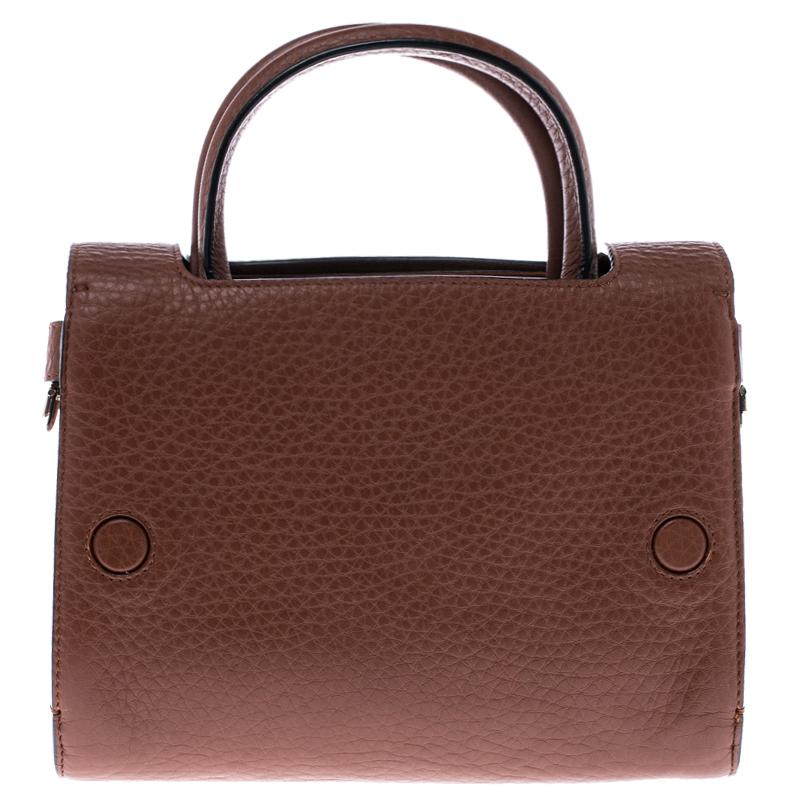 Every stitch and detail on this Diorever bag gives high praise to quality craftsmanship and validates the painstaking effort that goes into making a handbag art as fine as this. Structured to perfection using the finest leather and designed with a