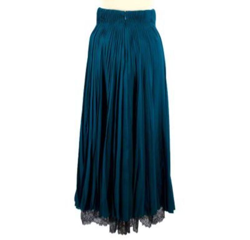 Dior Teal Pleated Silk Midi Skirt with Black Lace & Mesh

- Teal blue pleated silk midi skirt with black lace and mesh trims 
- Slit down one side revealing the black mesh underskirt 
- Black lace trim at the bottom hem
- Boning inside at the waist