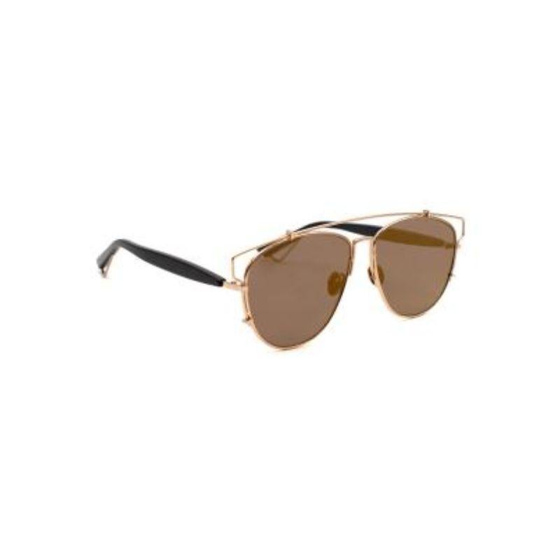 Dior Technologic Aviator Sunglasses

- Gold tone hardware 
-Double bridge detailing
-Mirrored lenses
-Metal frame 
-Brown shade lenses 

Material: 

Acetate 
Metal 

Made in Italy 

PLEASE NOTE, THESE ITEMS ARE PRE-OWNED AND MAY SHOW SIGNS OF BEING