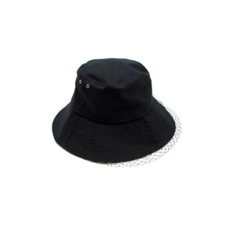 Dior Black Oblique Trimmed bucket hat with veil

- Large brim with topstitching
- Contrasting brim
- Brim lined with black emblematic Dior Oblique motif
- Veil detailing

Material
53% Polyester, 42% Cotton, 5% Polyurethane

Made in Italy

PLEASE