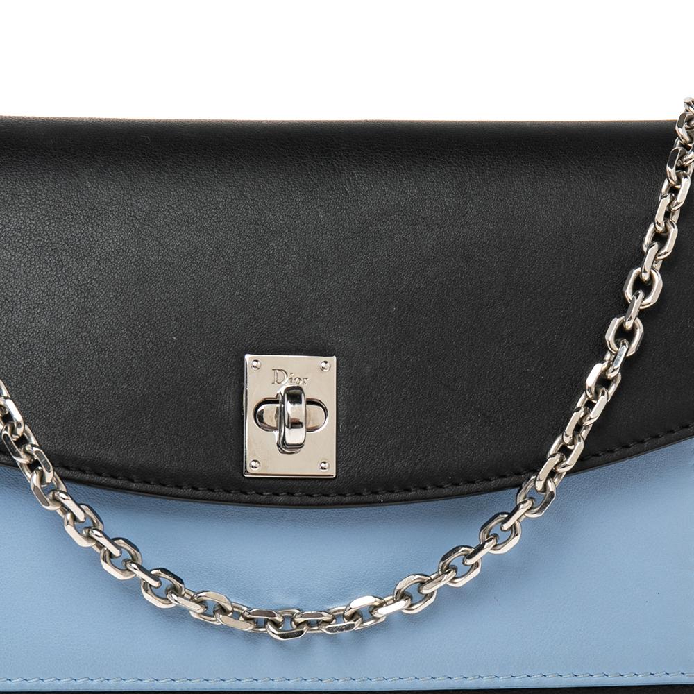 This creation from Dior is so pretty it will surely make a fine buy. Crafted from leather, this clutch comes in three hues. The front flap has a Dior lock that opens to a compact interior with multiple card slots. A shoulder chain is provided to