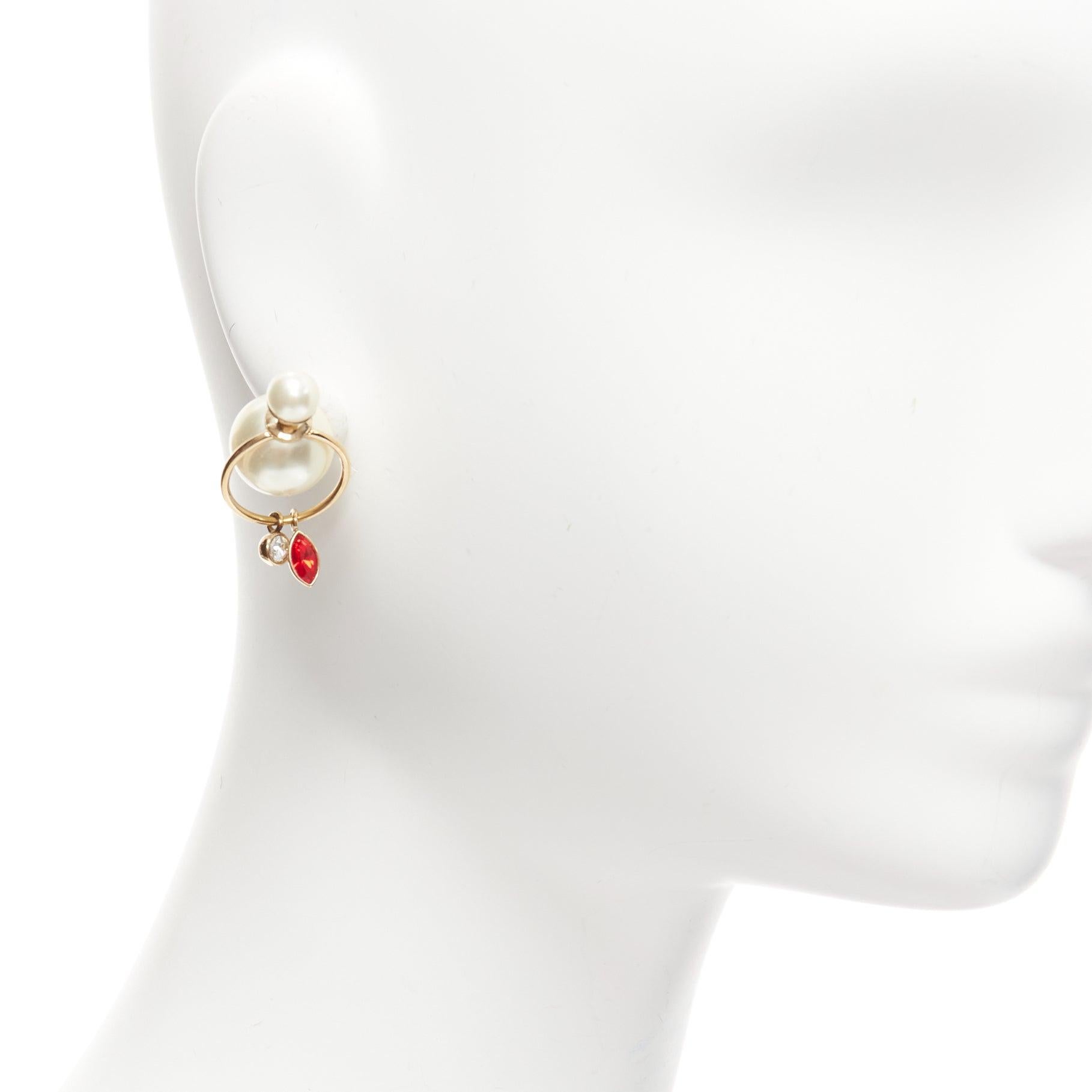 DIOR Tribale double pearl red clear crystal droplets hoop stud earrings pair
Reference: AAWC/A00914
Brand: Dior
Designer: Maria Grazia Chiuri
Material: Faux Pearl, Metal
Color: Gold, Pearl
Pattern: Solid
Closure: Pin
Lining: Gold