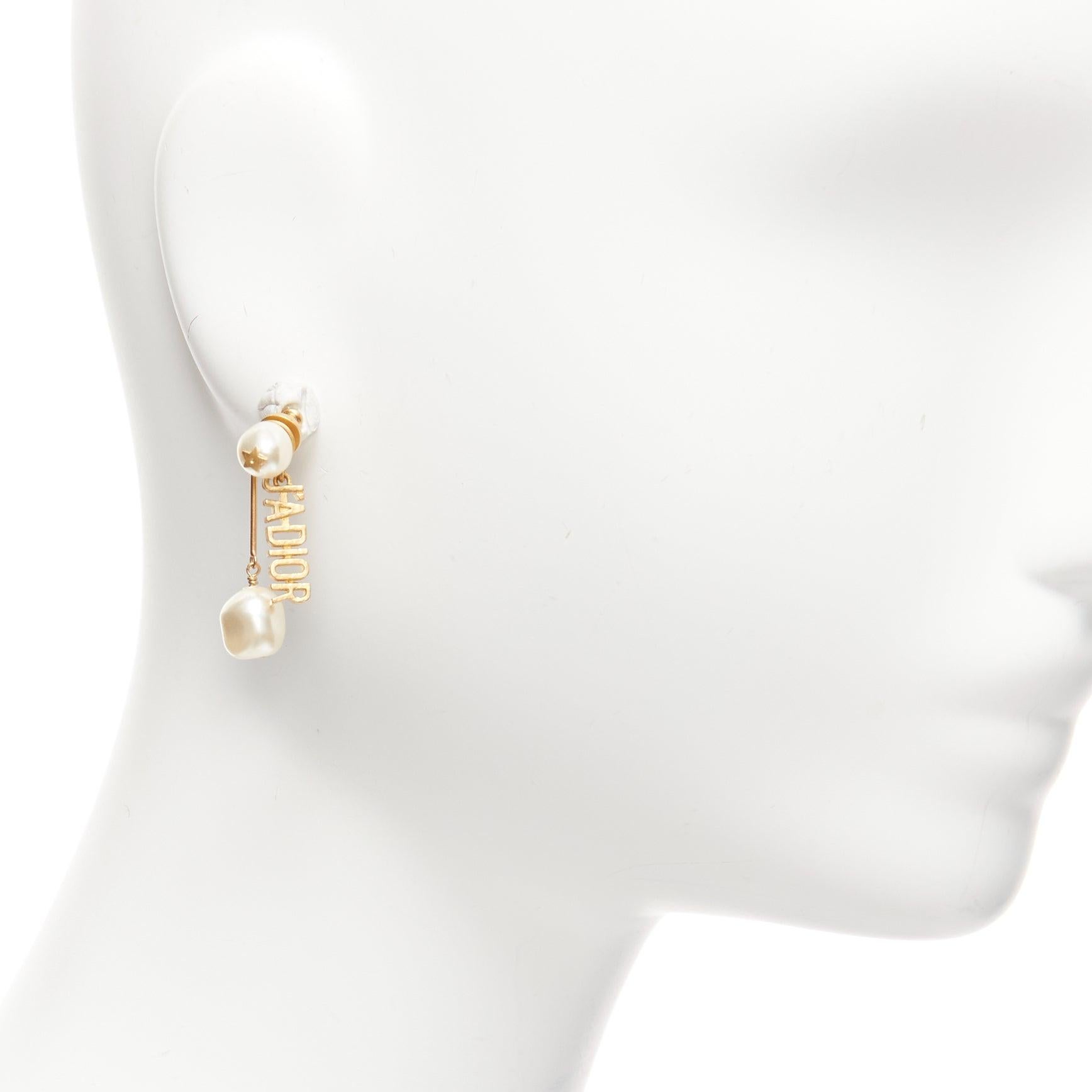 DIOR Tribale J'adior gold faux pearl logo drop star pin asymmetric stud earrings pair
Reference: AAWC/A00898
Brand: Dior
Designer: Maria Grazia Chiuri
Collection: J'adior Tribale
Material: Faux Pearl, Metal
Color: Gold, Pearl
Pattern: Solid
Closure: