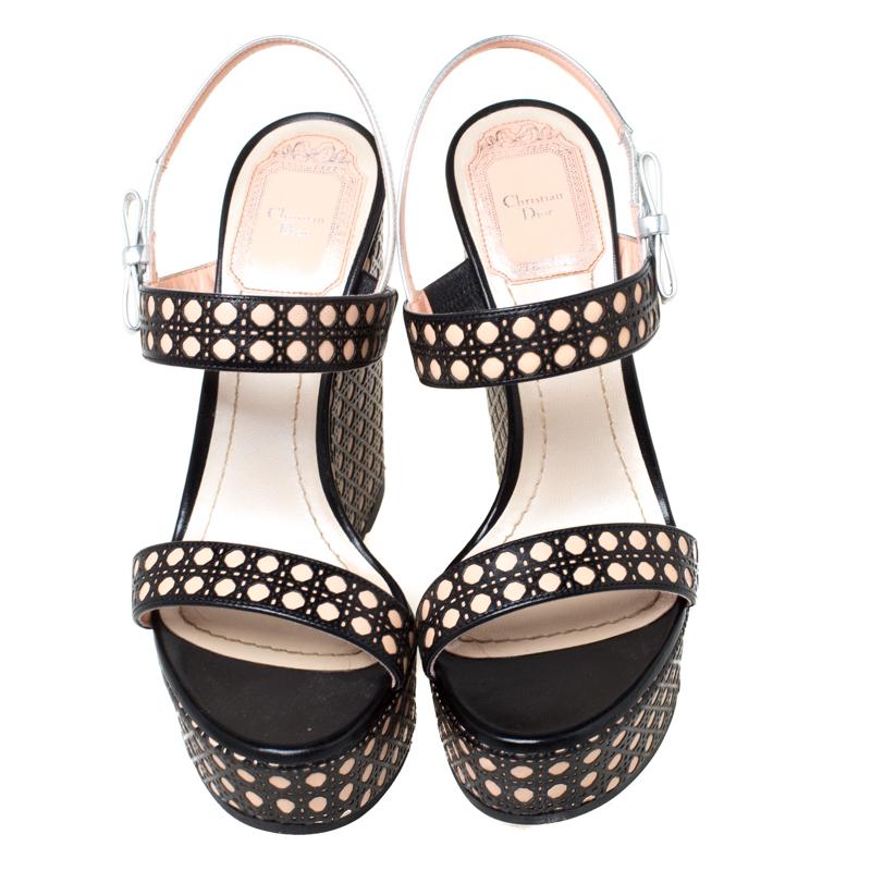 Look you casual best as you step out in these leather sandals. These trendy sandals carry the signature Cannage pattern on the straps at the vamps as well as on the wedge heels. This classic pair by Dior is a closet staple for any woman. These