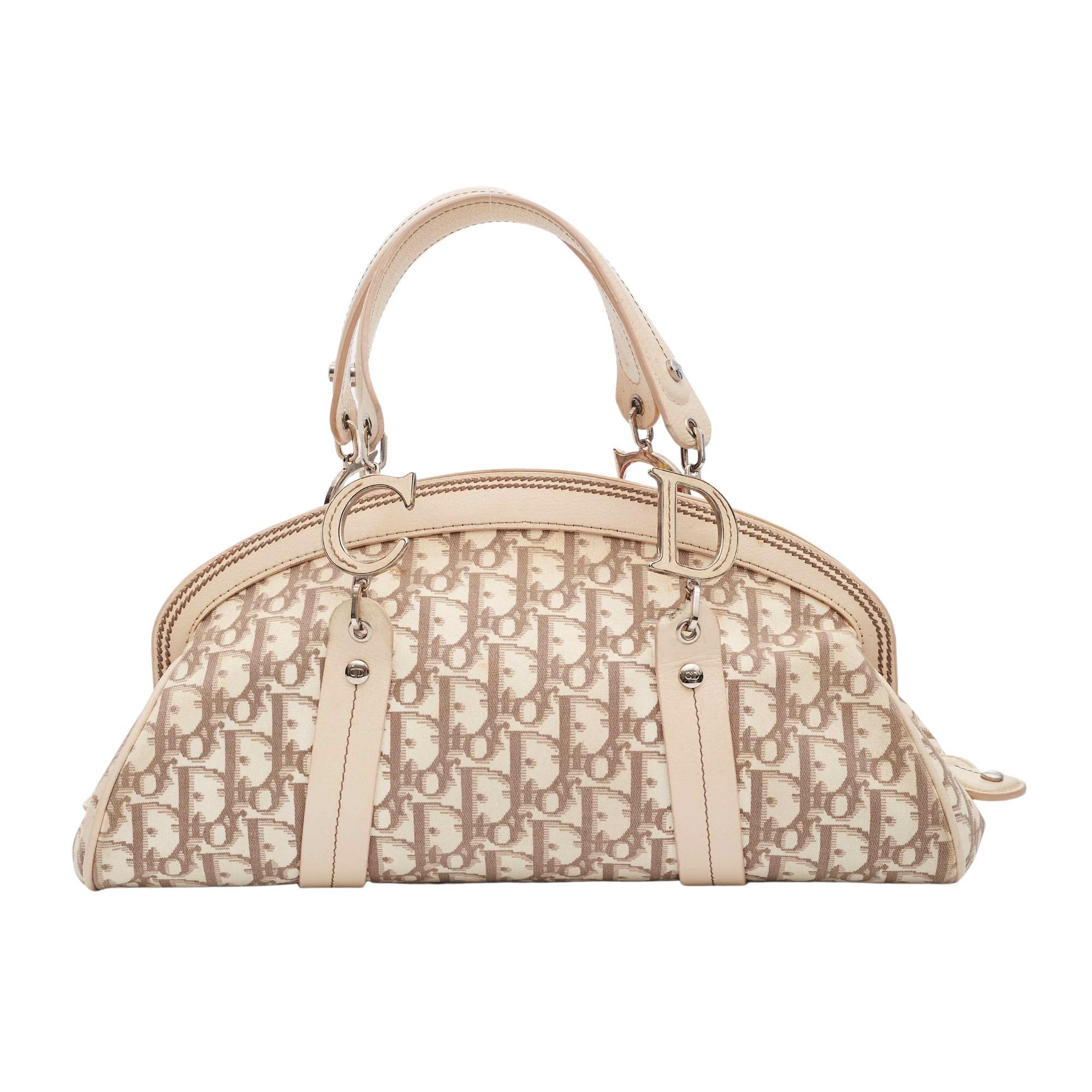 Ivory and taupe Diorissimo canvas Christian Dior vintage handle bag with silver-tone hardware, creme leather trim, dual flat handles featuring logo embellishments, multicolor embroidered 'Vintage Flowers' motif at front face, khaki nylon lining,