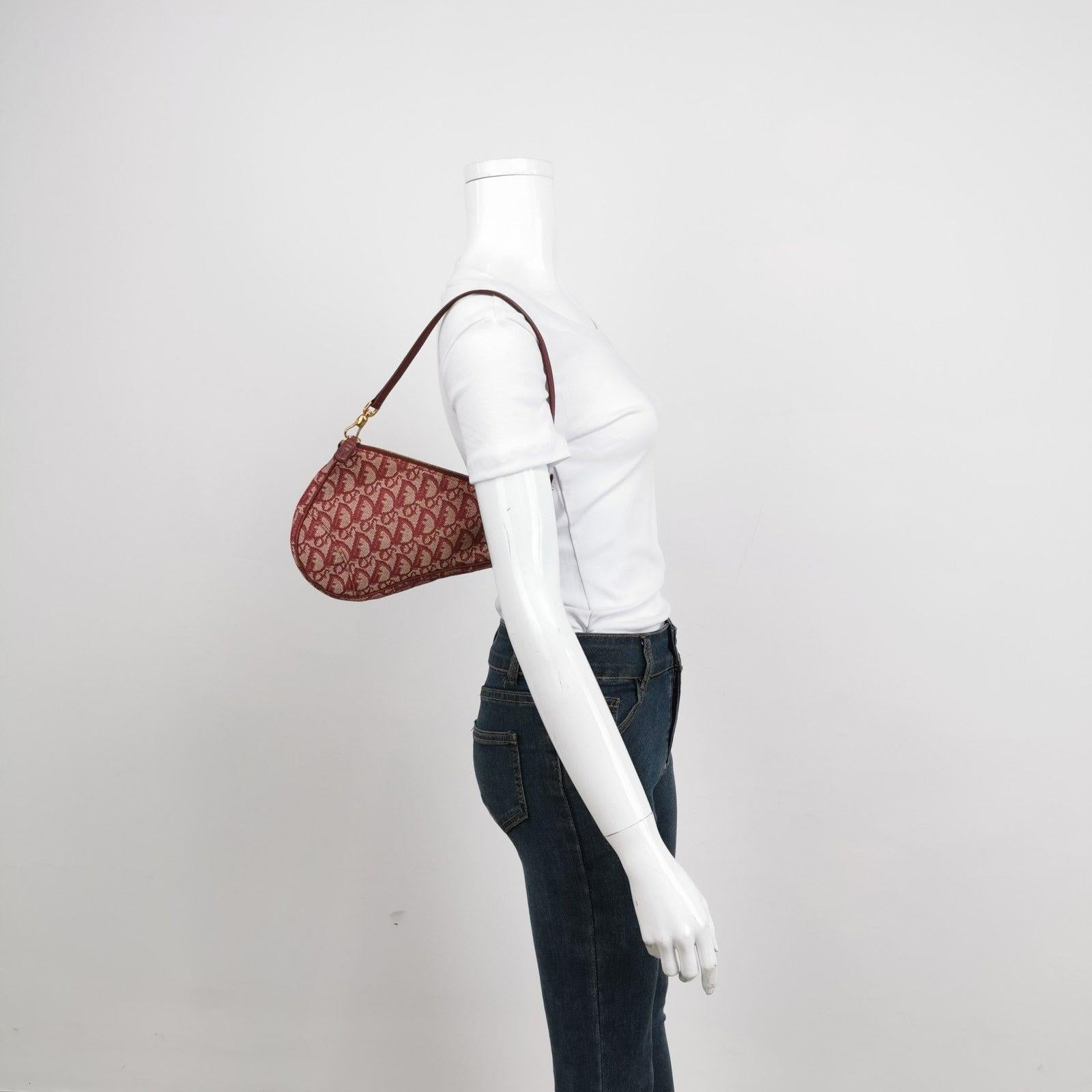Dior Trotter Mini Saddle bag Burgundy Red Oblique These are professional photos of the actual bag offered by Luxbags. Elevate your style with the chic and elegant Dior Trotter Mini Saddle bag in stunning red with oblique monogram design. The mini