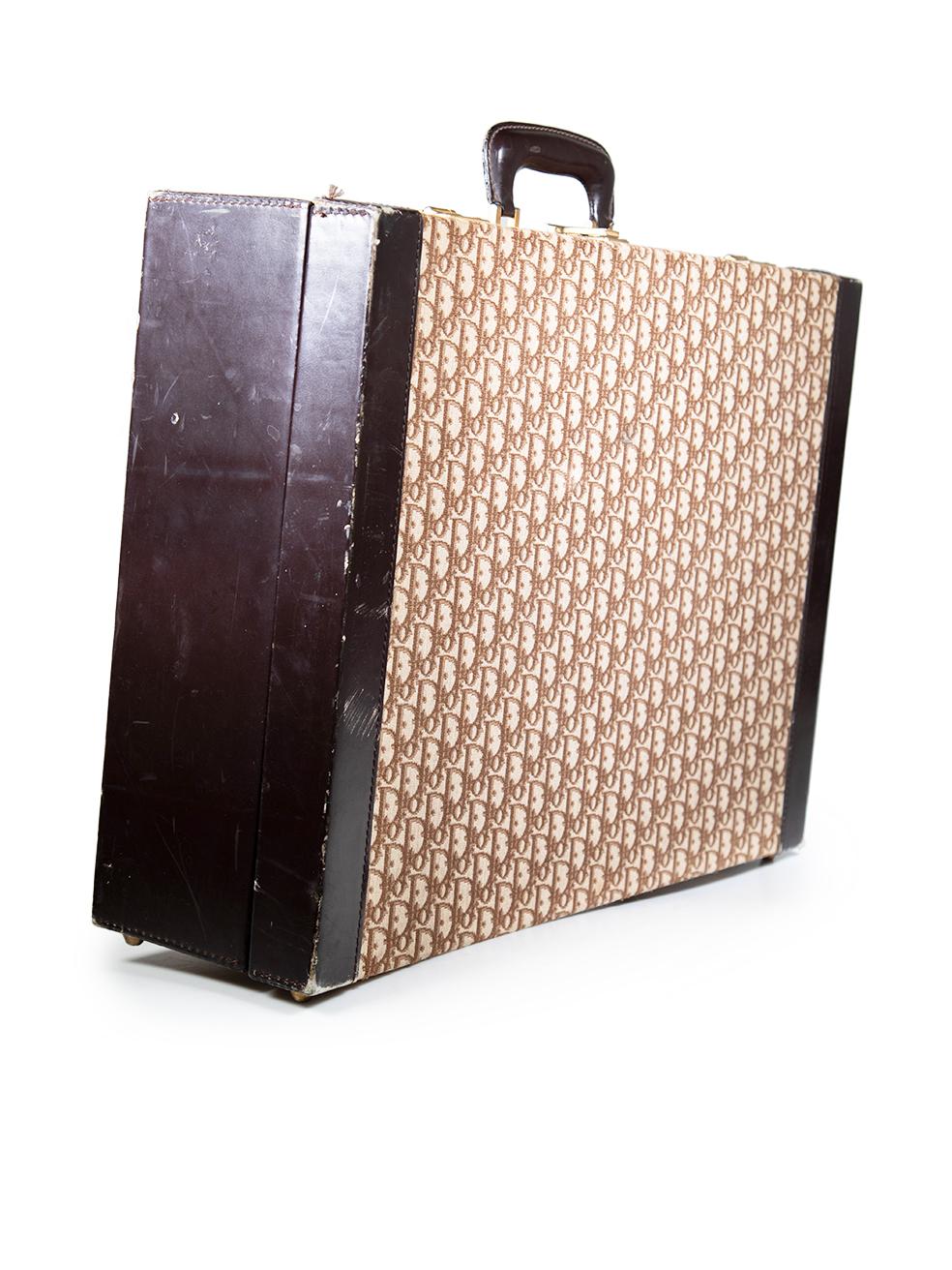 CONDITION is Good. General wear to suitcase is evident. The exterior corners and edges have abrasions and wear to them, some areas are discoloured. The leather boarders and handle have abrasions, indentations and discolouration. The hardware is