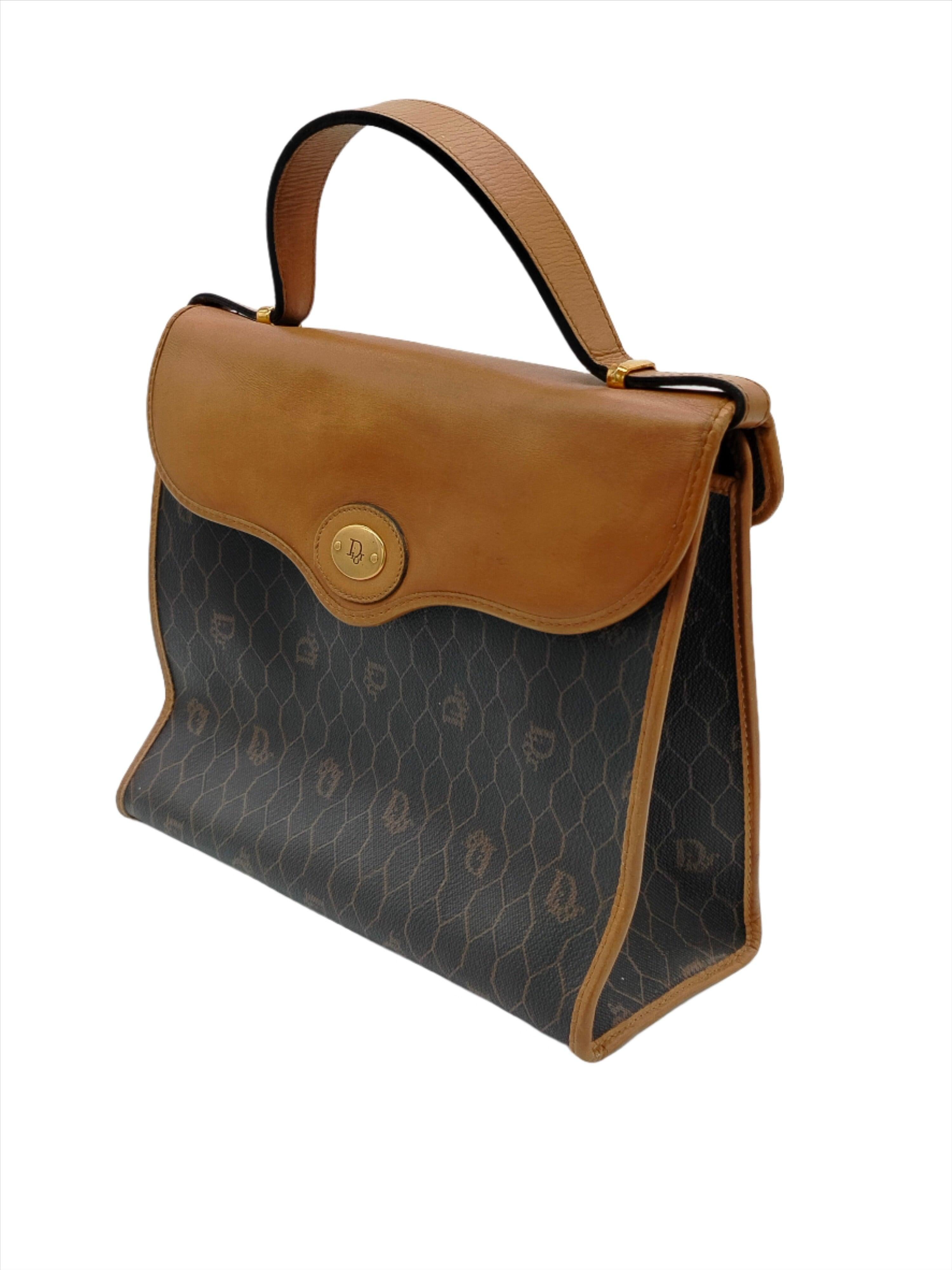Crafted from canvas, the Christian Dior Beehive Bag embodies the timeless elegance of the brand. Featuring an elegant and sophisticated design, this bag is perfect for adding a touch of glamour to any outfit.

Height:20;Width:24;Depth:10 Material: