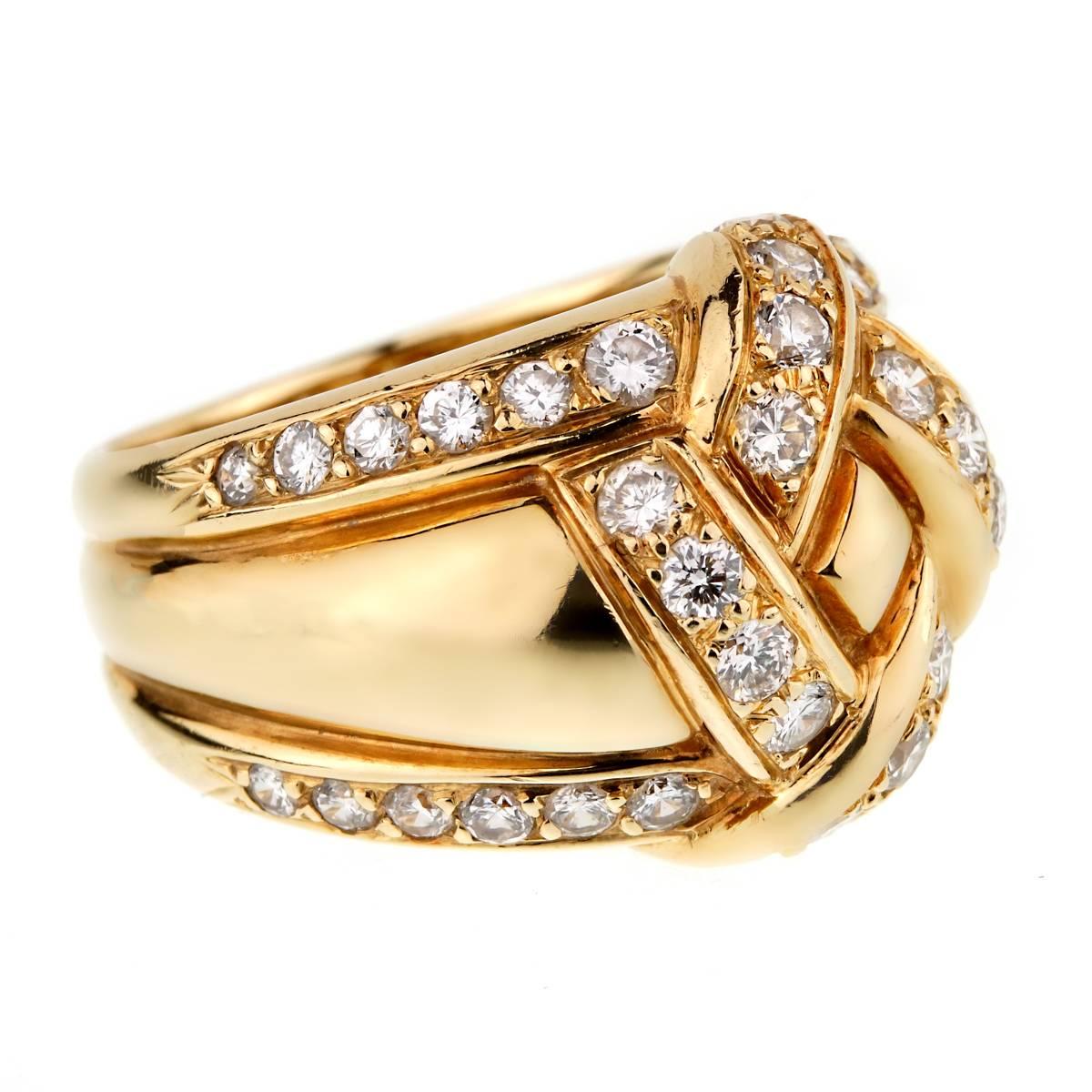A stunning Dior ring circa 90's showcasing a bombe style design set with round brilliant cut white diamonds in 18k yellow gold. 

Size 6 1/2 Resizeable

Sku: 0000909