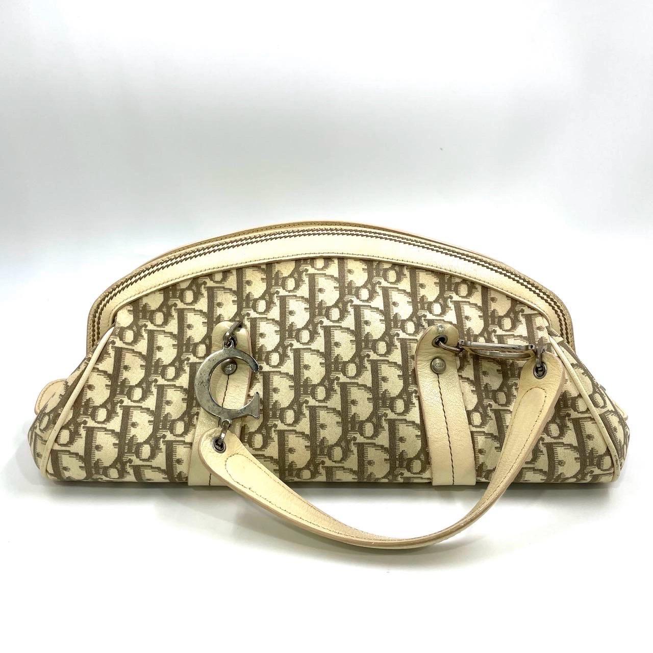 Condition: GOOD

preloved/ preowned My Dior bag is in good condition with light signs of use. Light creases and scuffs to the Piping. Scratches on hardware. Light stains and yellowing on the canvas.

DETAILS

Brand: Christian Dior

Model: