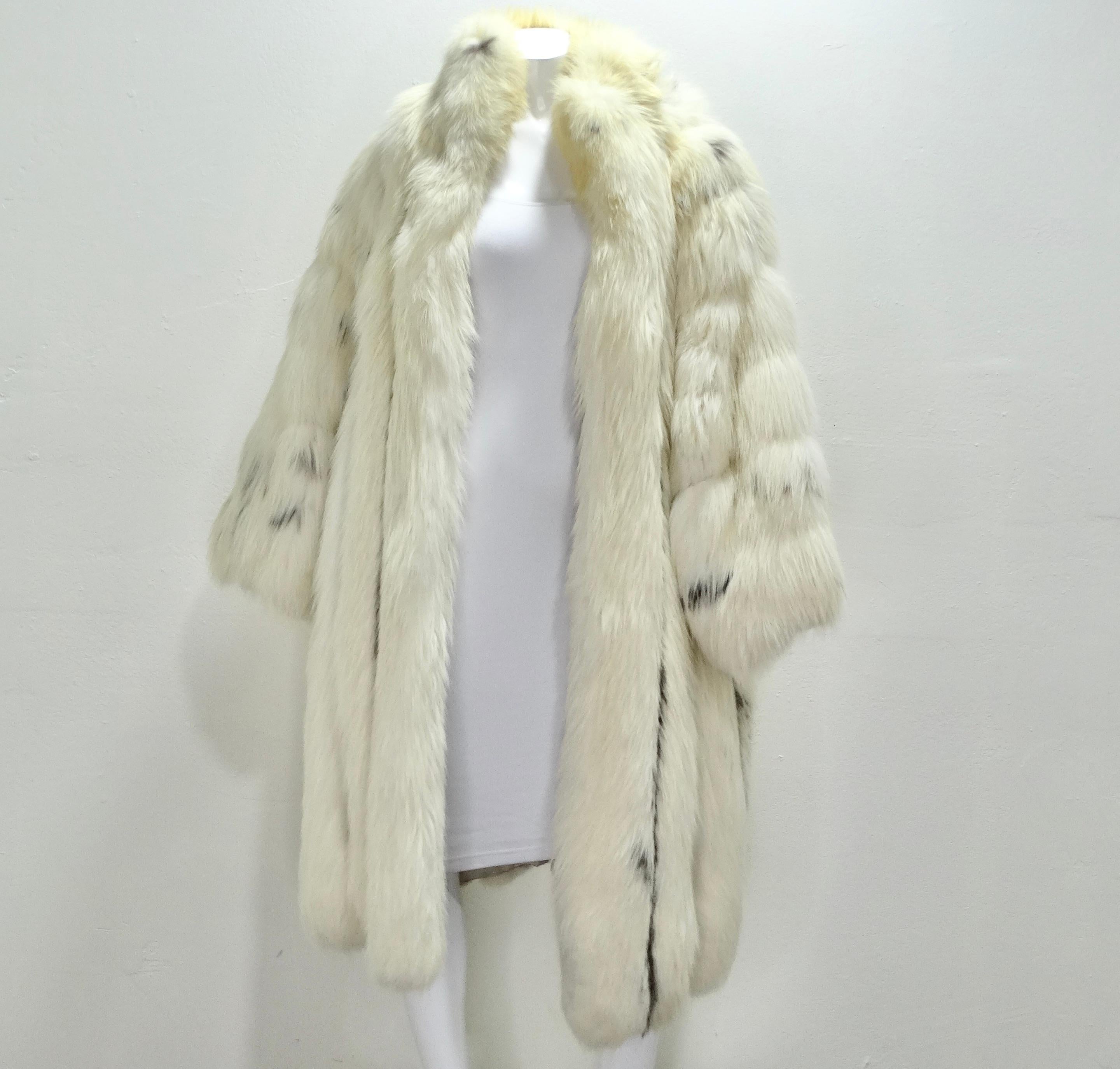 Do not miss out on this breath taking 1970s Christian Dior fur coat! The most luxurious and dramatic classic fur coat in an elegant ivory fox fur. Look closely and notice the deep brown stripes throughout, this is such a chic detail that really