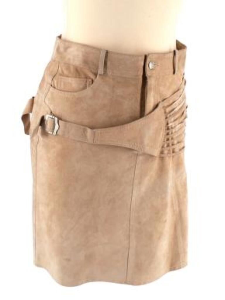 Dior vintage Galliano camel suede strappy buckle mini skirt
 

 -Camel suede mini skirt
 -Buckle on the left 
 -Silver hardware 
 -Concealed zip, and button fastening 
 -Lace up on right size
 -One front pocket
 -Buckle details on back as well
