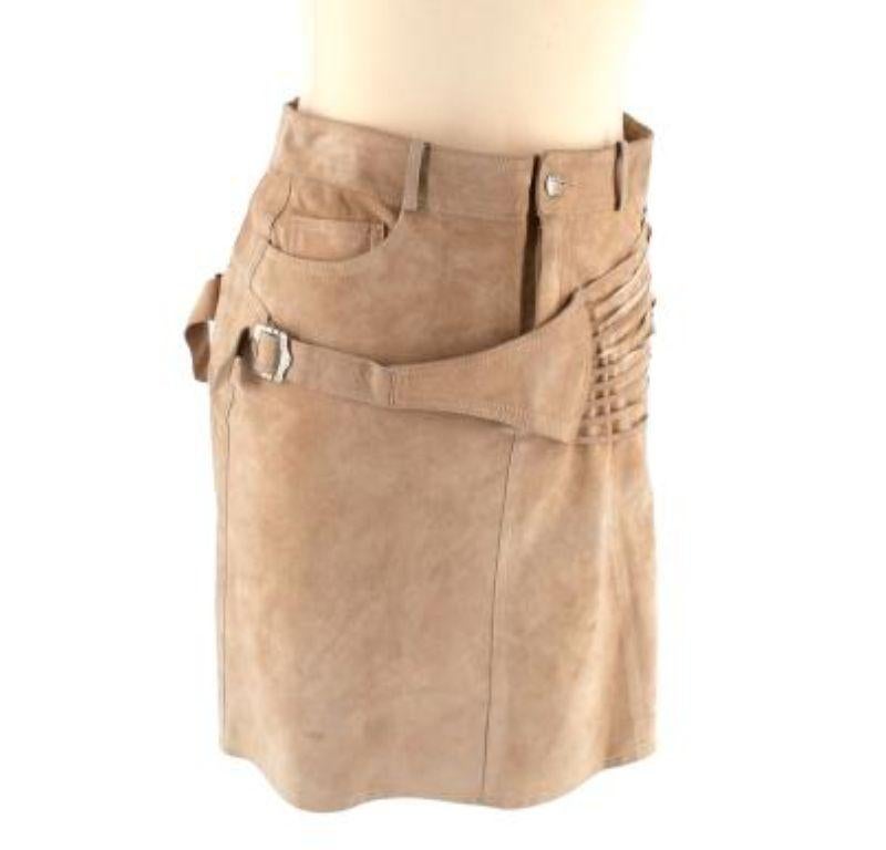 Dior vintage Galliano camel suede strappy buckle mini skirt

-Camel suede mini skirt
-Buckle on the left 
-Silver hardware 
-Concealed zip, and button fastening 
-Lace up on right size
-One front pocket
-Buckle details on back as well
-Seam