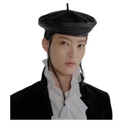 Dior Vintage Lambskin beret is revisited in a couture variation. Size 57
