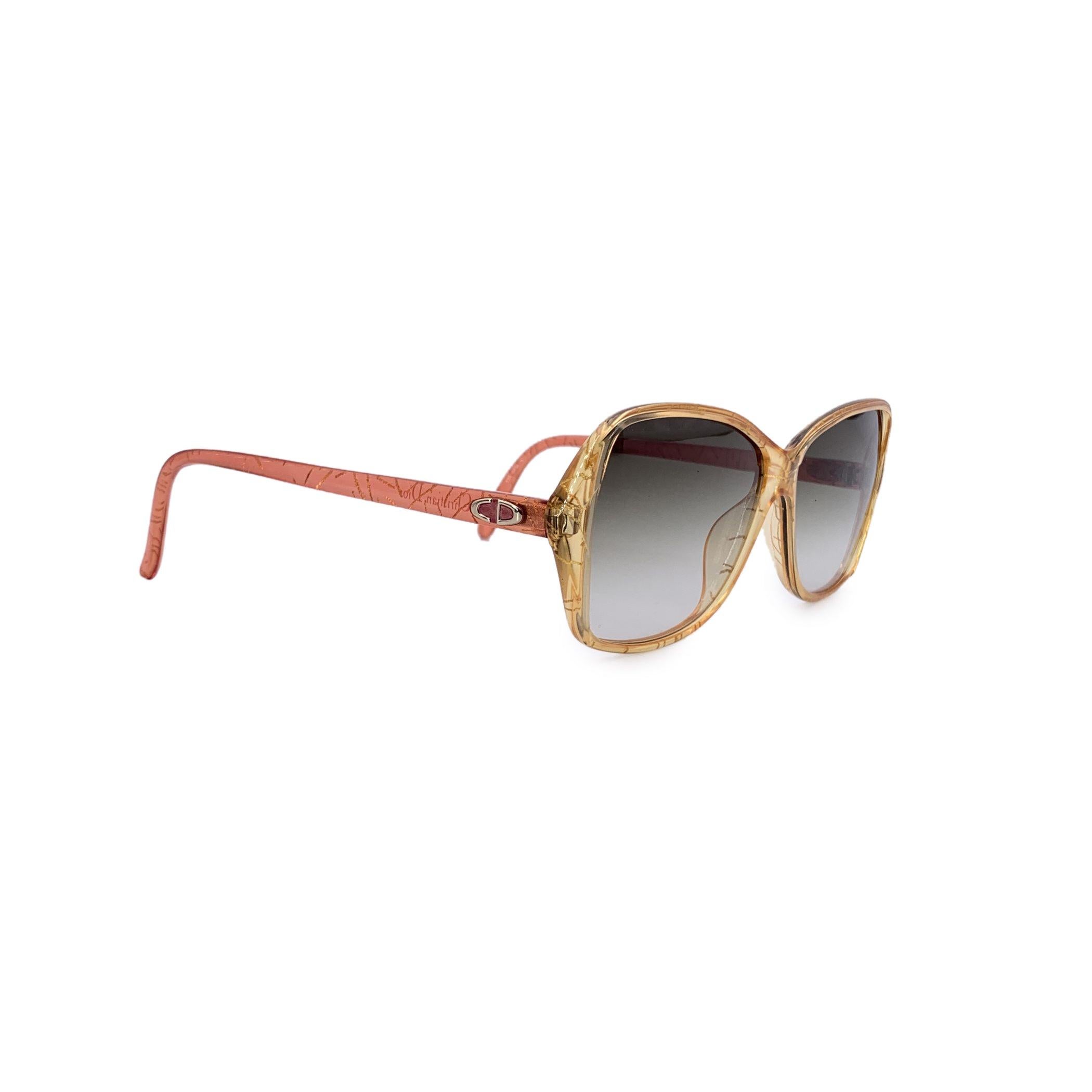 A true masterpiece from Dior's 1980s collection, these vintage yellow sunglasses are a bold and beautiful representation of the brand's iconic flair. With their stunning golden-yellow butterfly-shaped frame, they effortlessly combine elegance and