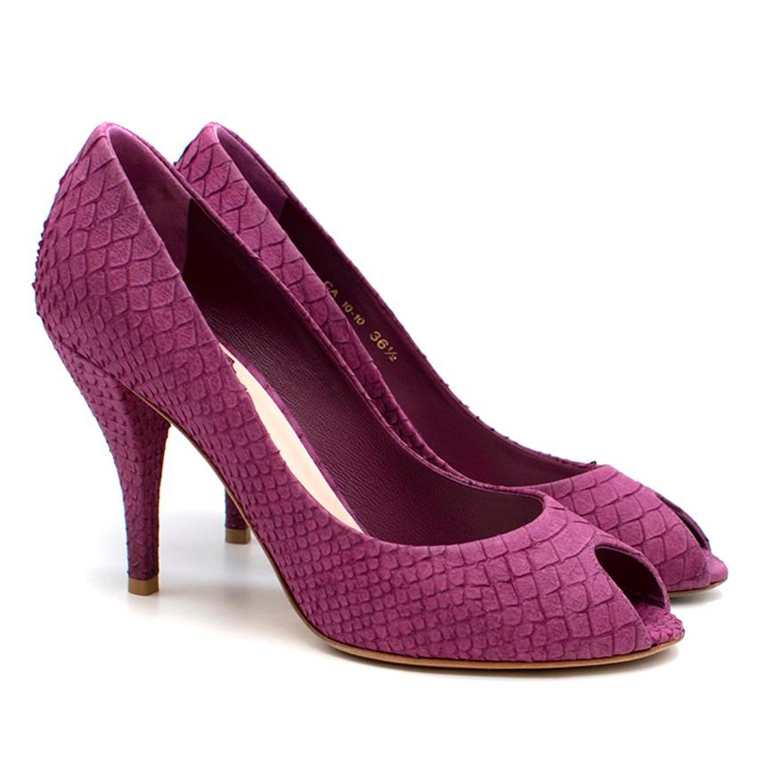 Christian Dior Violet 'Miss Dior' Leather Peep Toe Pumps

- Suede, violet
python embossed
- Peep toe
- Mid-length heel
 - Leather insole 
- Signature gold metal 'CD' logo plaque on heel panel

Please note, these items are pre-owned and may show some