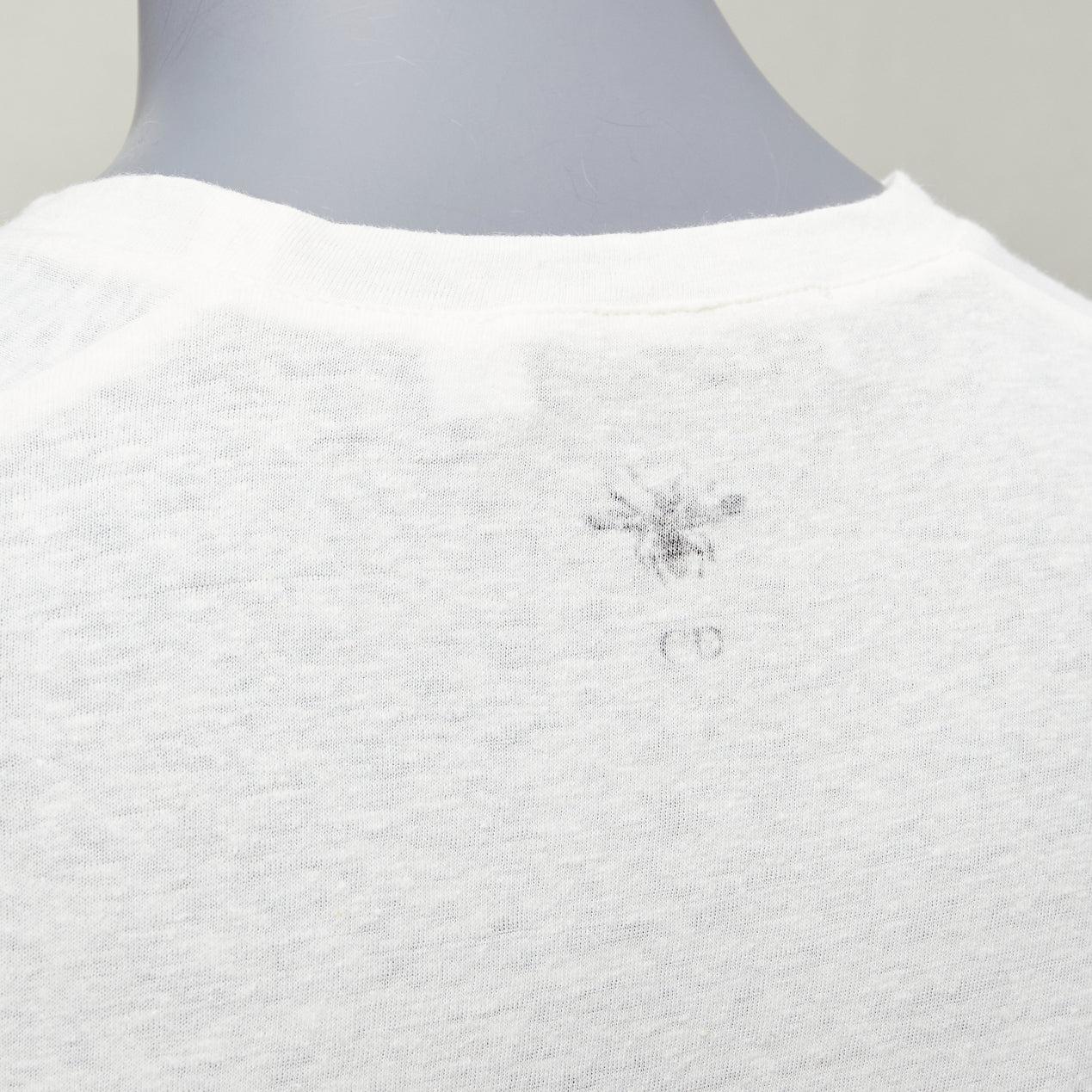 DIOR WE Rise By Lifting Others reversed print cotton linen white tshirt XS
Reference: AAWC/A00777
Brand: Dior
Designer: Maria Grazia Chiuri
Model: 113T03RL464
Material: Cotton, Linen
Color: Ecru, Black
Pattern: Solid
Closure: Pullover
Extra Details: