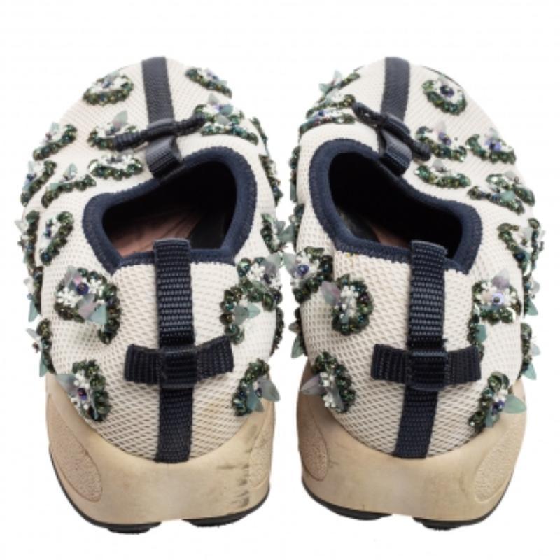 The words 'edgy' and 'ultra-modern' can be readily attributed to this pair from Dior. The sneakers were first introduced as a part of their Haute Couture Spring/Summer 2014 collection. Crafted from mesh, they feature dainty embellishments and rubber
