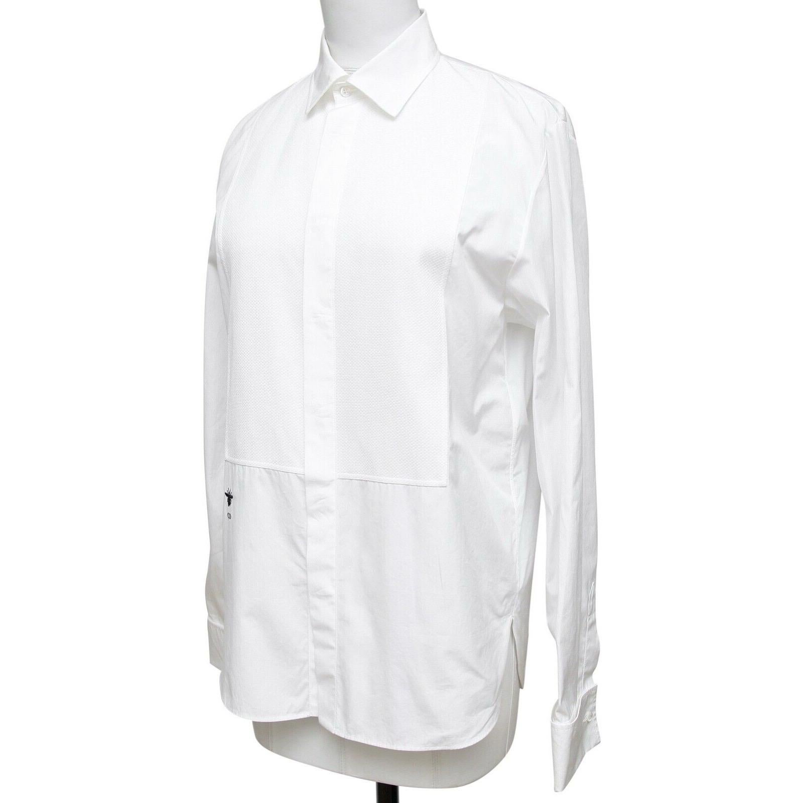 GUARANTEED AUTHENTIC DIOR WHITE COTTON POPLON PLASTRON BLOUSE

Retails excluding sales taxes $1,350

Design:
- Comfortable to wear button down white shirt.
- Pointed collar.
- Plastron design.
- Long sleeve, button at each cuff.

Size: 36

Material: