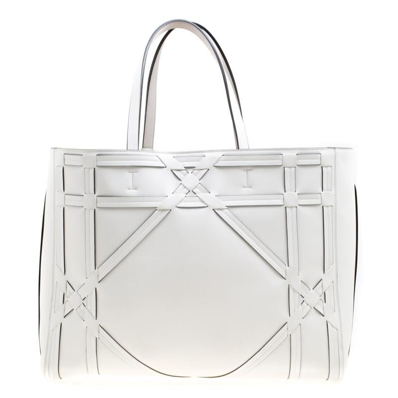 An absolute delight, this shopper tote is a Dior creation. Crafted from leather, the bag features the signature Cannage detail, two shoulder handles and a suede interior sized perfectly to hold your essentials. This shopper tote is accompanied by a