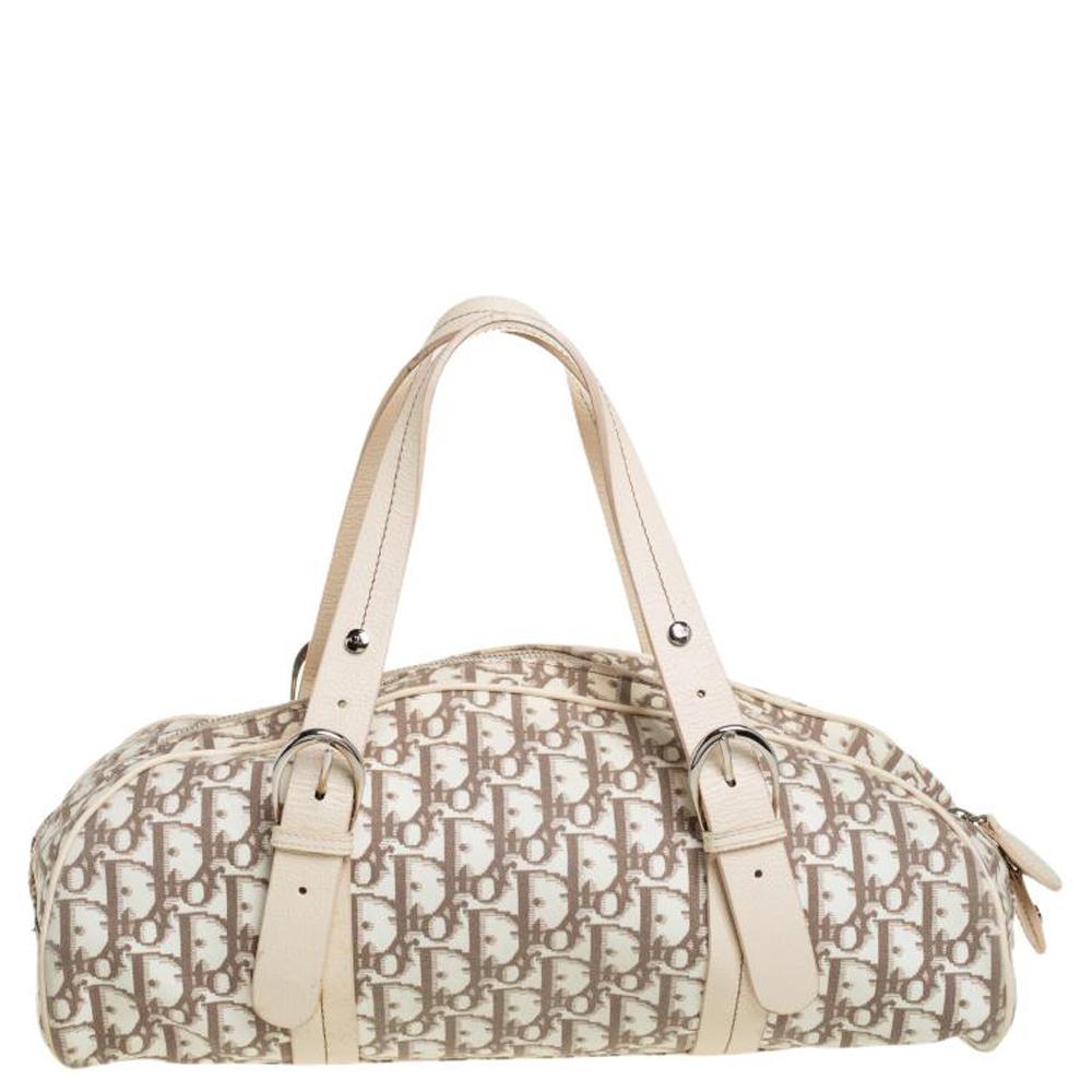 Every modern-day wardrobe needs a Dior bag like this. Look stunning with this white bag accurate for you. Carefully designed to evoke an expensive and fashionable feel, this Oblique floral canvas & leather bag is sure to make heads turn.

