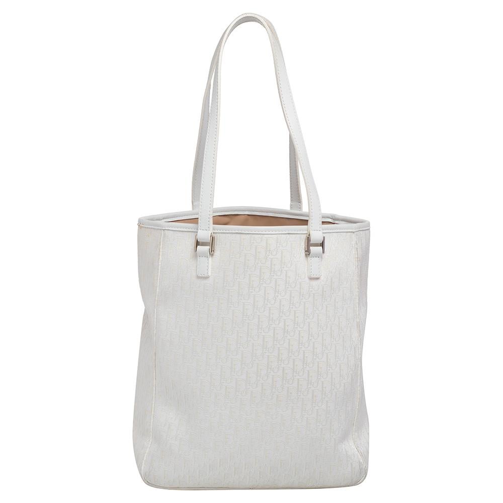 White is an all-women's favorite and so would be this Dior Tote. Crafted in Diorissimo canvas, the bag features double flat handles and has minimal silver-tone details. An open top exhibits a fabric-lined interior and has a zip pocket.

Includes: