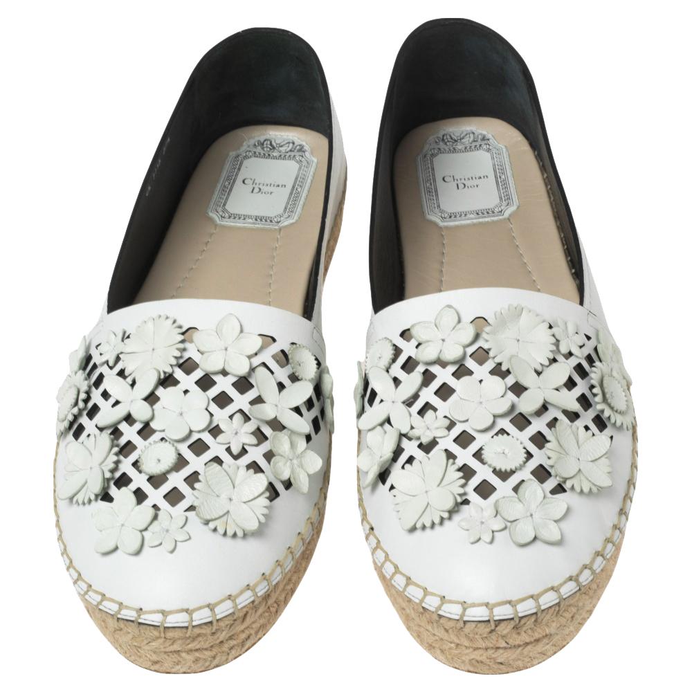 Step out in style every day with these gorgeous espadrilles from Dior. Featuring a pretty design of laser cuts and floral appliques, this round toe pair is completed with braided midsoles. Slip these on with shorts and dresses.

Includes: Original