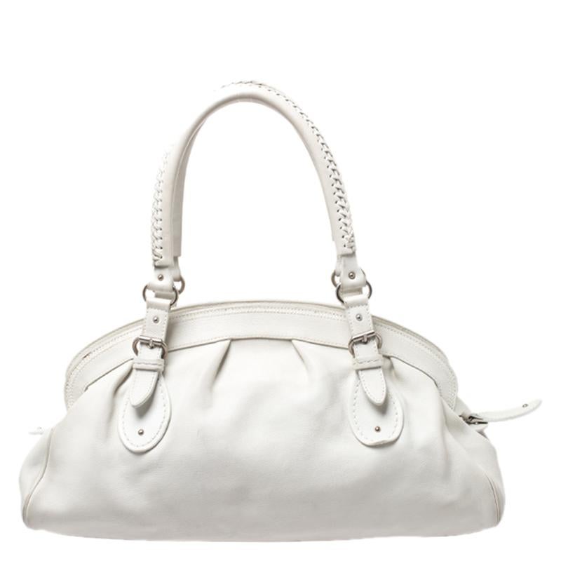 This gorgeous creation by Dior will surely meet all your fashion expectations. The My Dior satchel has a lovely silhouette and chic appeal that can be owed to the label's excellent craftsmanship and creative flair. It is crafted with white leather