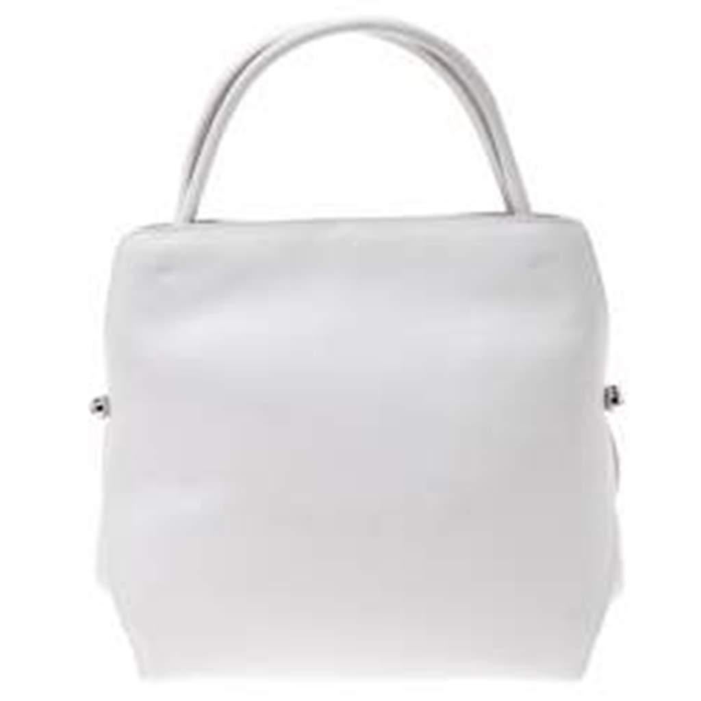 Look elegant and feminine wearing this Dior Bar tote which is big enough to hold all that you need and more along with a beautiful design that will never let you down. Crafted in white leather, this bag features a drawstring closure, two top handles