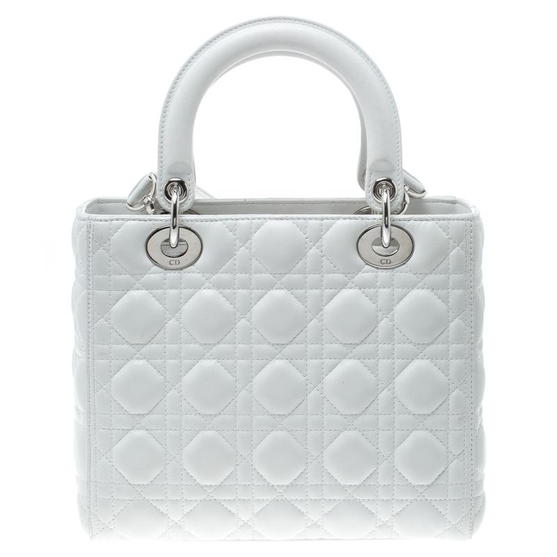 The Lady Dior tote from Dior is remarkable, highly coveted, and since its birth in 1994, it has swayed us with its shape, design, and beauty. This version is a charmer! It comes meticulously crafted from leather and designed in their signature