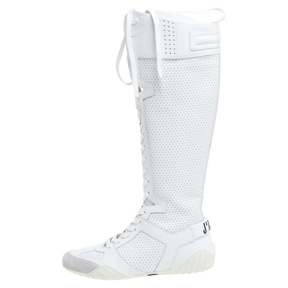 Avant-garde style and comfort combine to deliver these D-Fence sneakers by Dior. They have been crafted from quality leather with perforated detailing. They have a knee-high silhouette, lace-ups in the front, logo detailing on the counters, leather