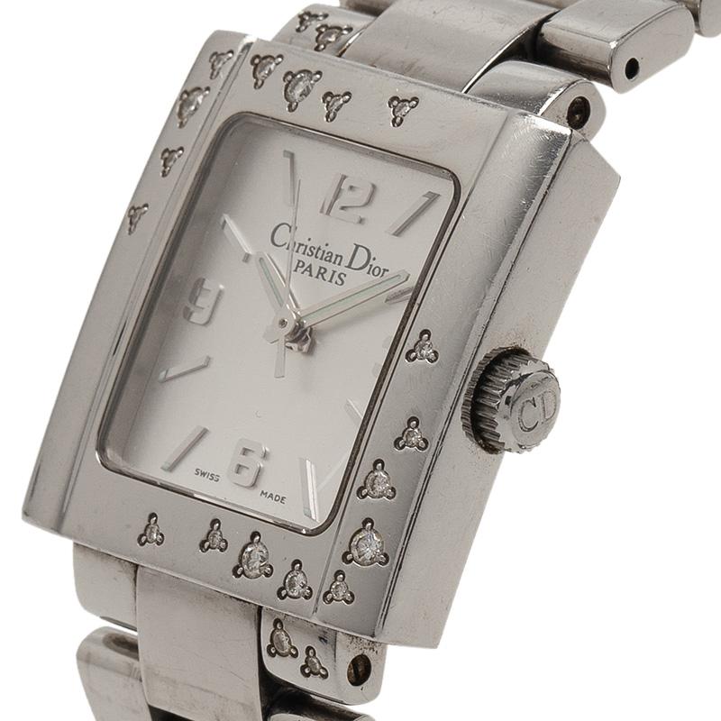 This classy watch by Christian Dior is made from stainless steel and features a rectangular, crystal encrusted case. The white dial houses a date window, bar indicators and Arabic numerals. This Quartz timepiece is water resistant up to 30m and