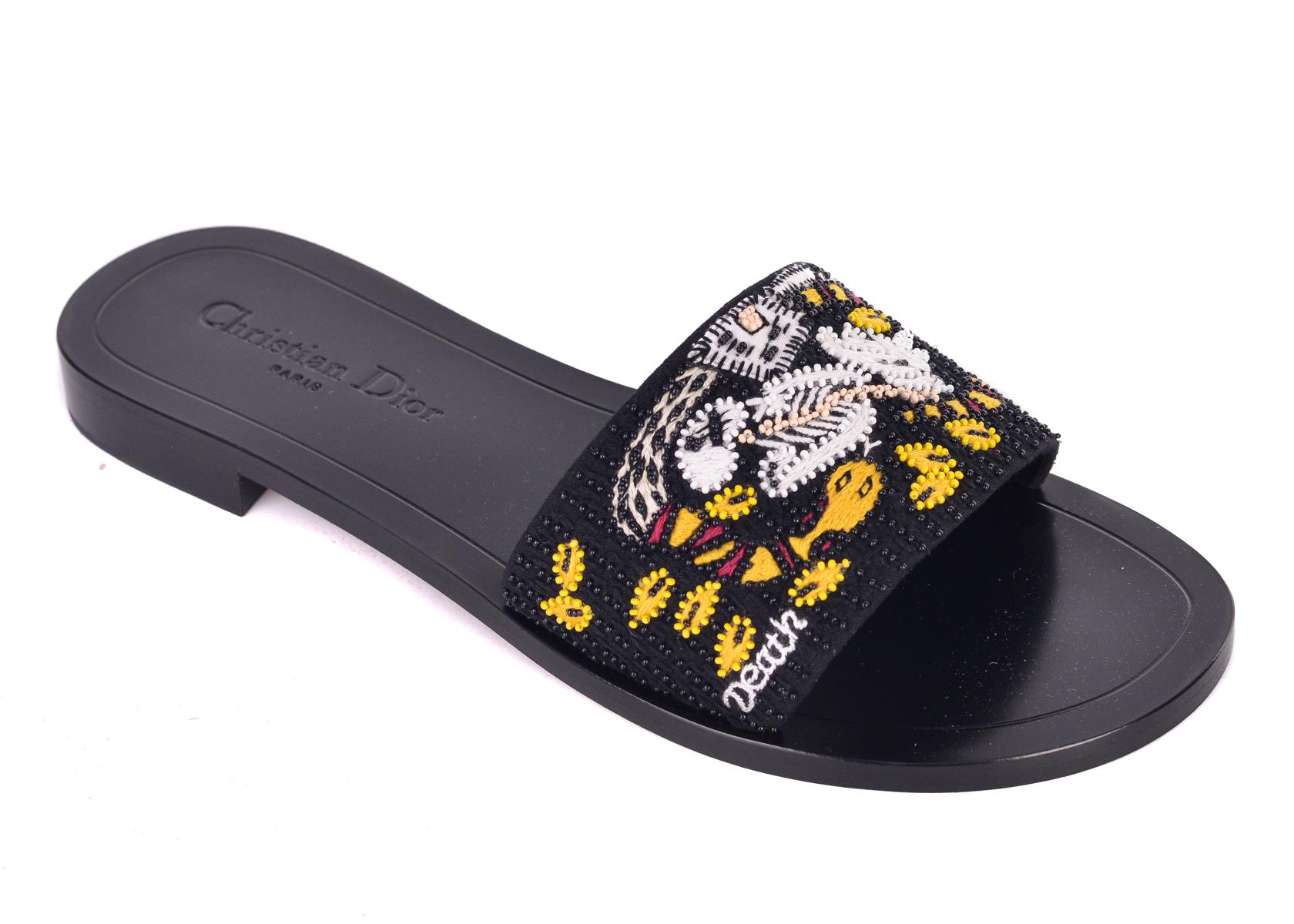 Christian Dior's Dior Tarot Death Embroidered Slippers. These slippers are crafted with intricate embroidered designs for a chic edgy look. Pair with regular denims for those slipper clogs for a chic everyday look.

Christian Dior's Dior Tarot Death