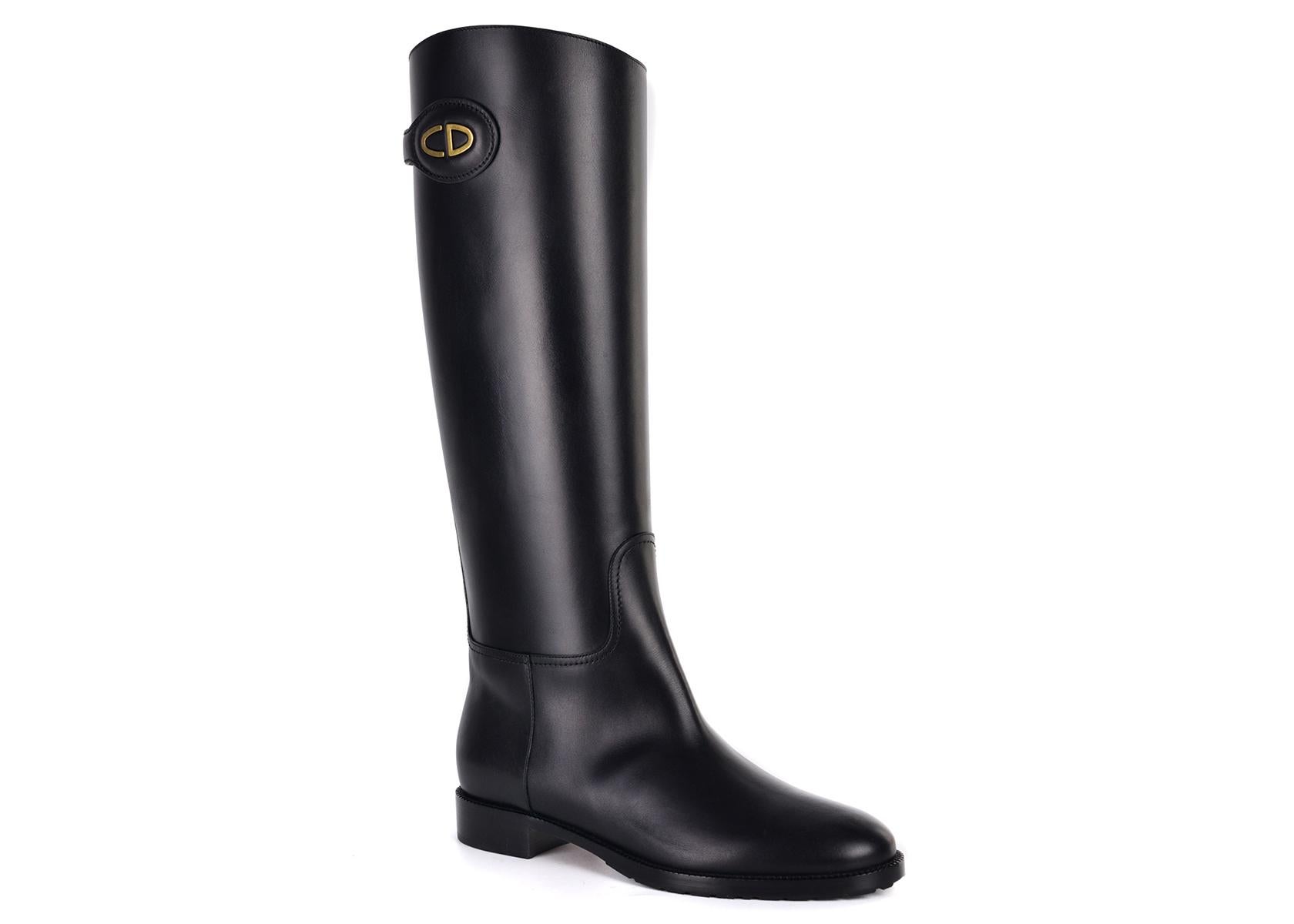 Christian Dior's Diorable knee high boots. These boots feature an all over classic black with a gold tone logo for an eccentric ankle boot. Perfect stand out shoes for that accented accessorie in your everyday wardrobe. 

Christian Dior's Diorable