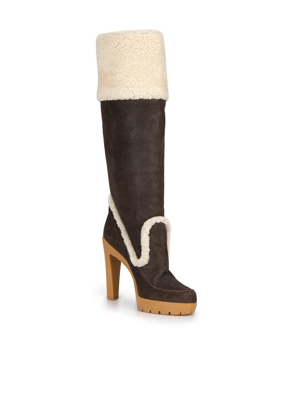 CONDITION is Never Worn. Small mark on inside cuff of right boot and dark mark is visible at the outer side of the left shoe heel on this used Dior designer resale item.



Details


Brown

Suede

Knee high boots

Round toe

Platform high