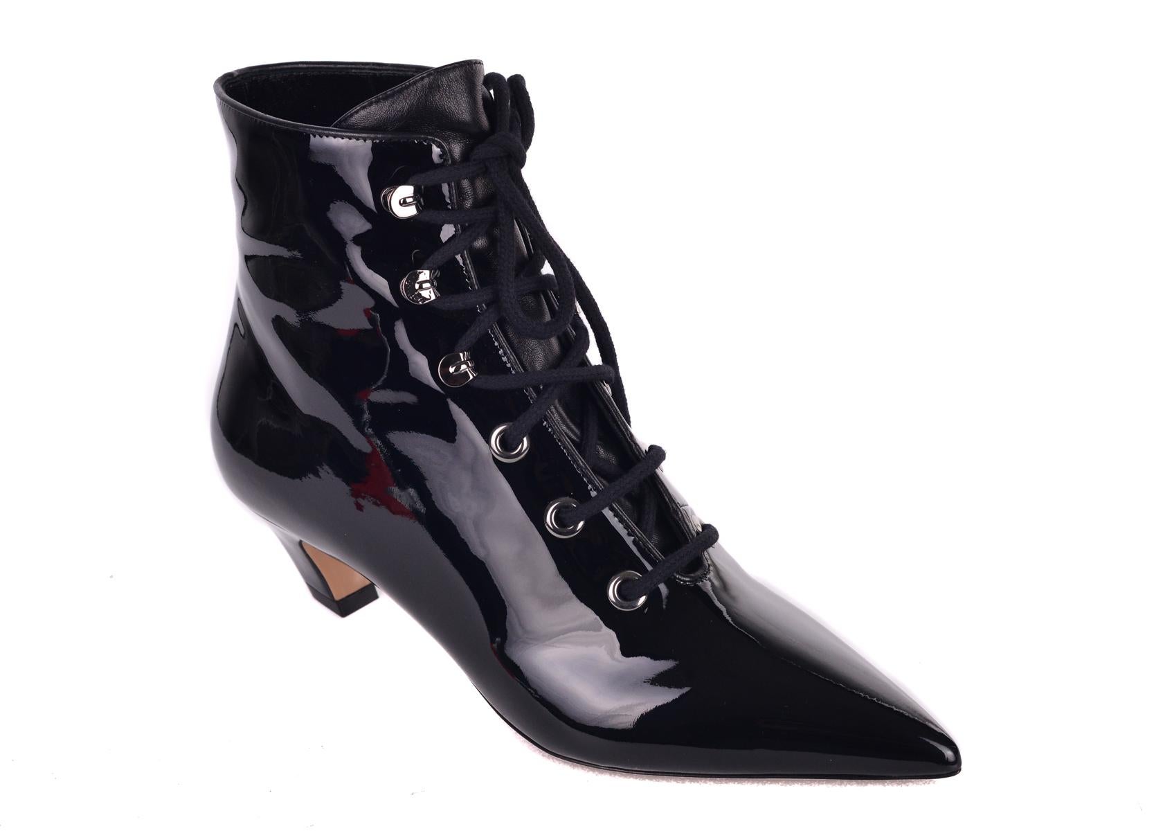 Christian Dior's I-Dior ankle boots. These boots feature an all over patented design for this eccentric ankle boot. Perfect stand out shoes for that accented accessories in your everyday wardrobe. 

Christian Dior's I-Dior ankle boots
Patent