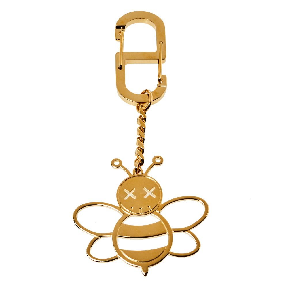 This keyring is from Dior x Kaws and is made from gold-tone metal featuring the reimagined bee as the charm. We can't help but admire its fine finish and delighting design.

Includes: Original Dustbag, Original Box