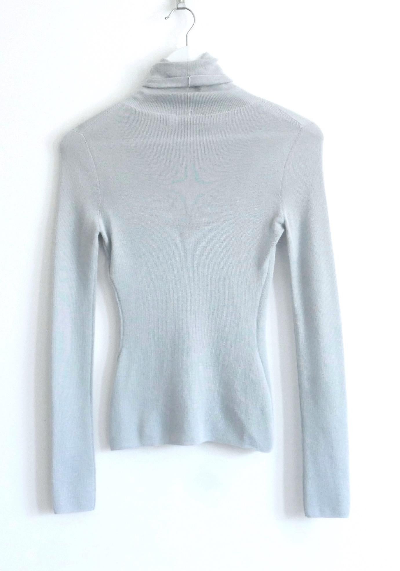 Divine Dior cashmere blend knit top from the Pre-Fall 2014 Collection. Bought for £1250 and unworn. 
Made from fine, super soft duck egg blue cashmere and silk, It has a high neck, a gently tailored shape with long, slim sleeves and silver tone CD