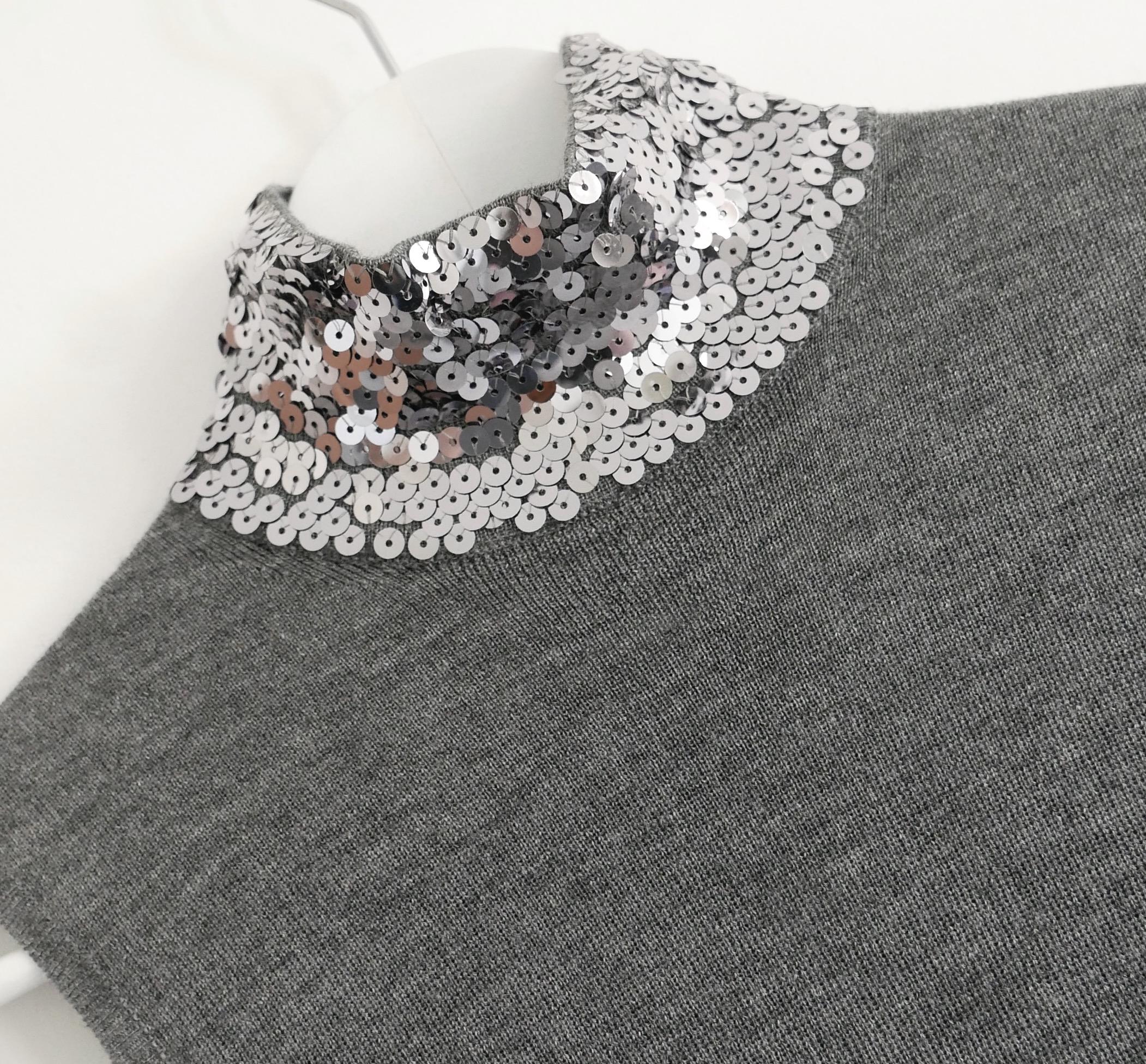 Absolutely stunning Dior sequin embellished sleeveless sweater from the Pre-Fall 2015 Collection. Bought for £1500 and unworn. 
Made from fine, super soft grey wool and silk mix with high neck covered in sparkling silver sequins. Has a gently